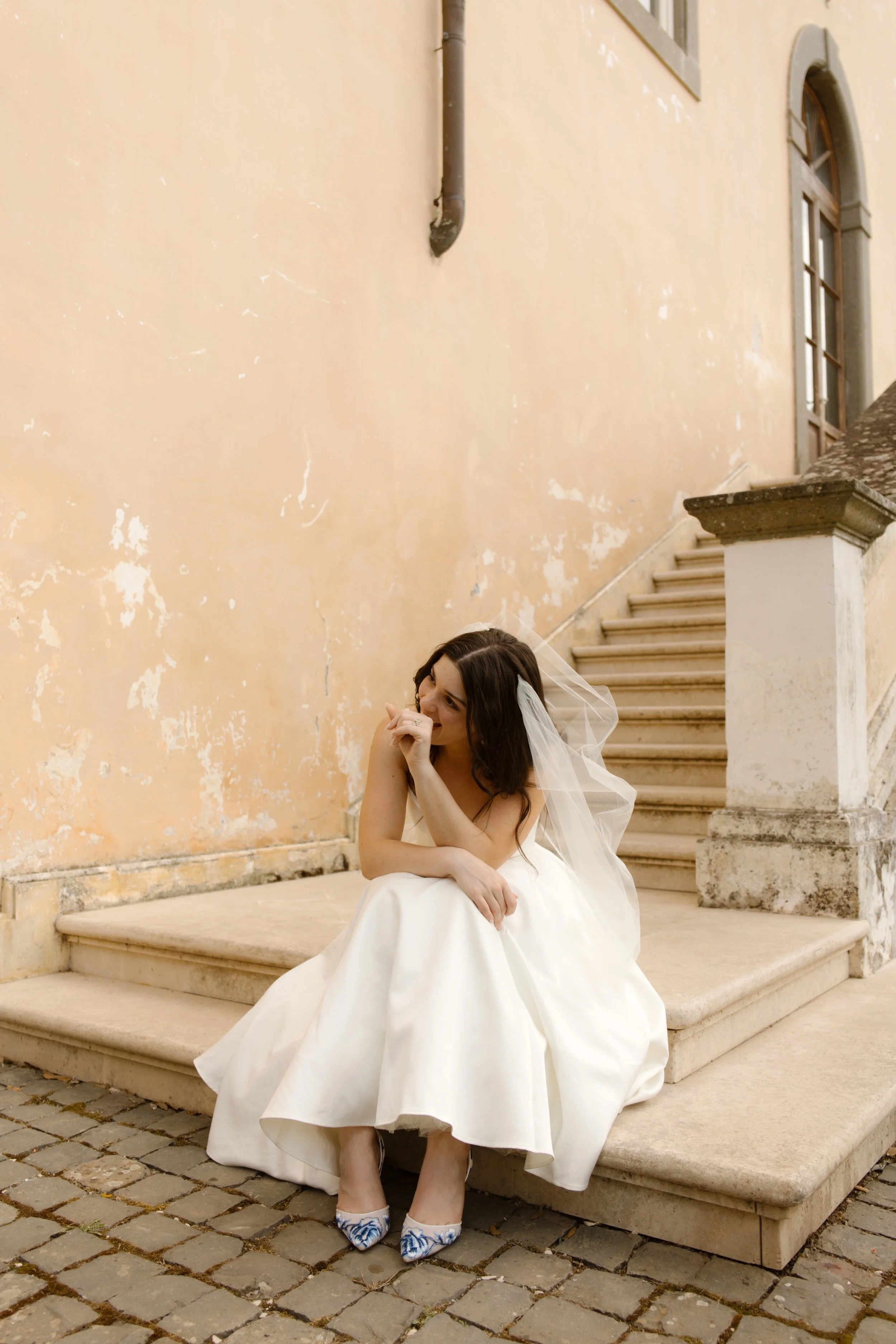 Bridal portrait on historic villa steps during a destination wedding in Italy wedding weekend