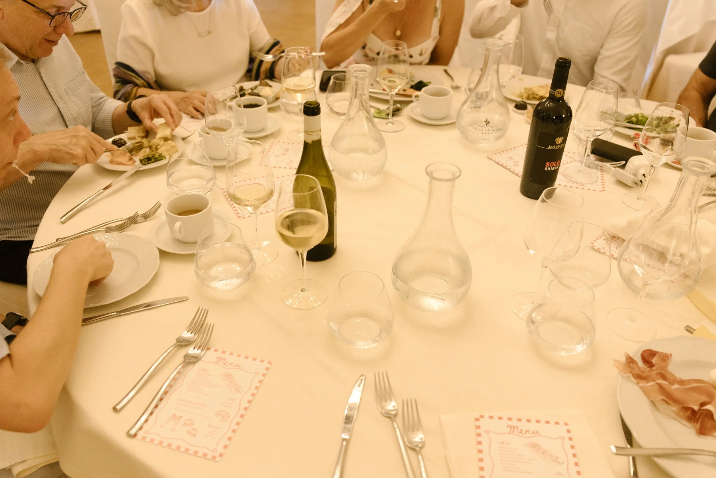 Family-style dinner table during a destination wedding in Italy farewell brunch reception