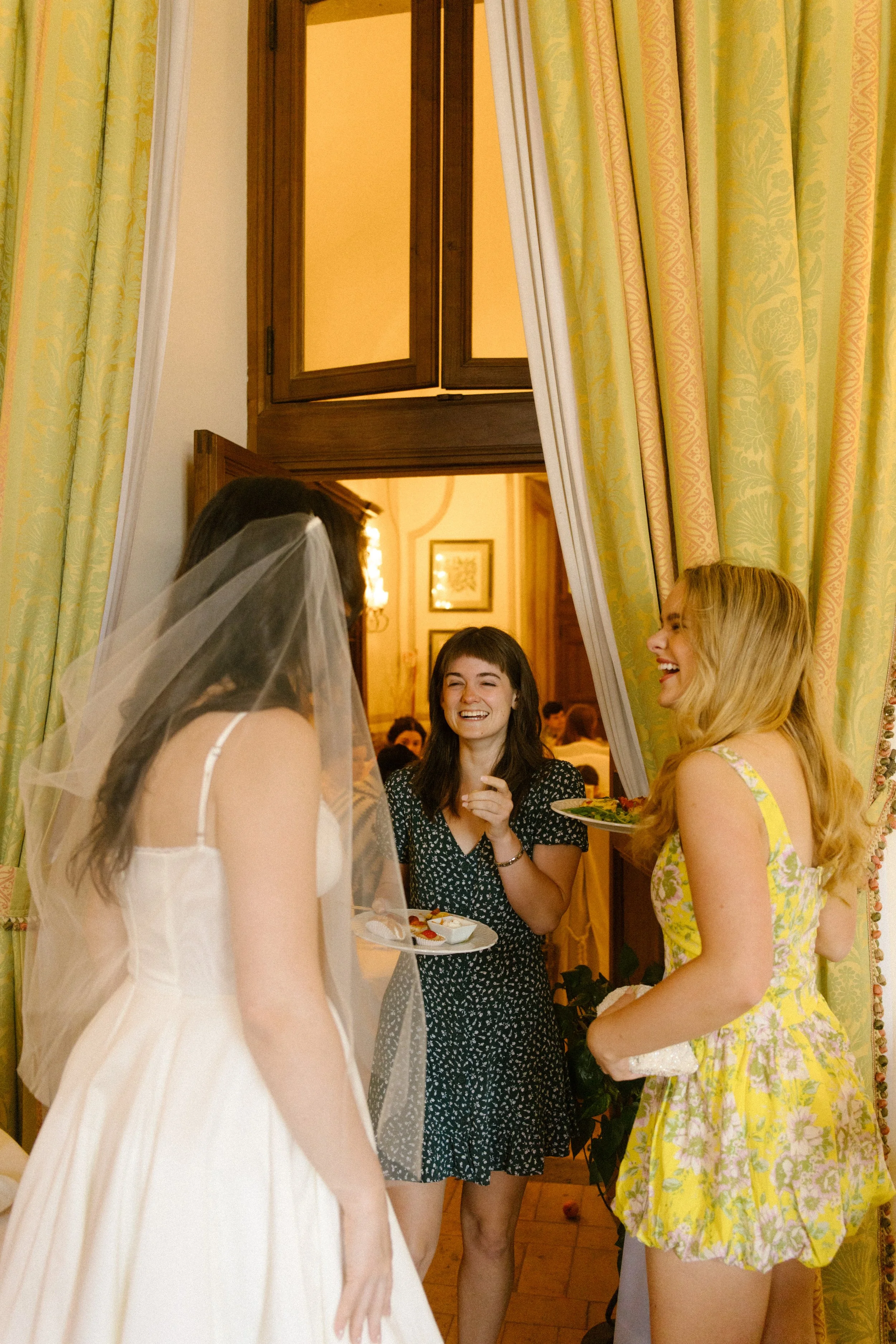 Bride laughing with friends during a farewell brunch at a destination wedding in Italy
