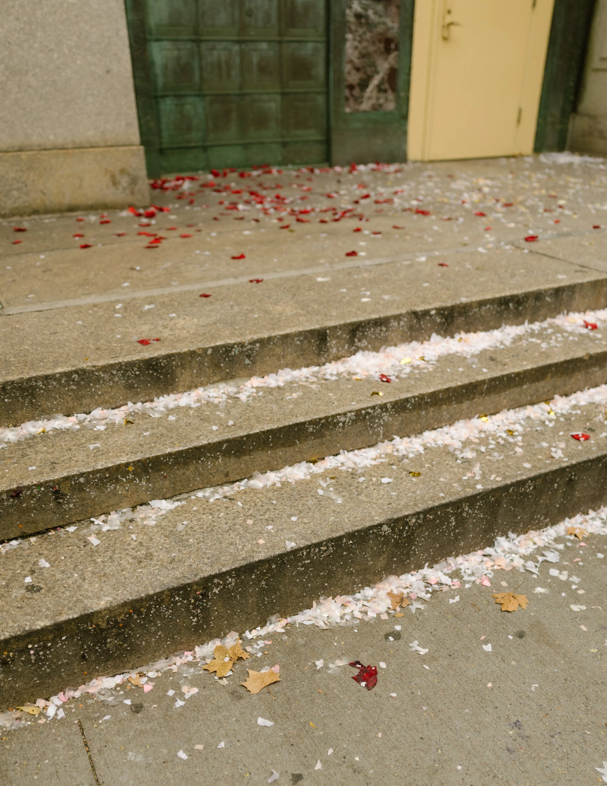Confetti-covered courthouse steps after a New York courthouse wedding in Manhattan