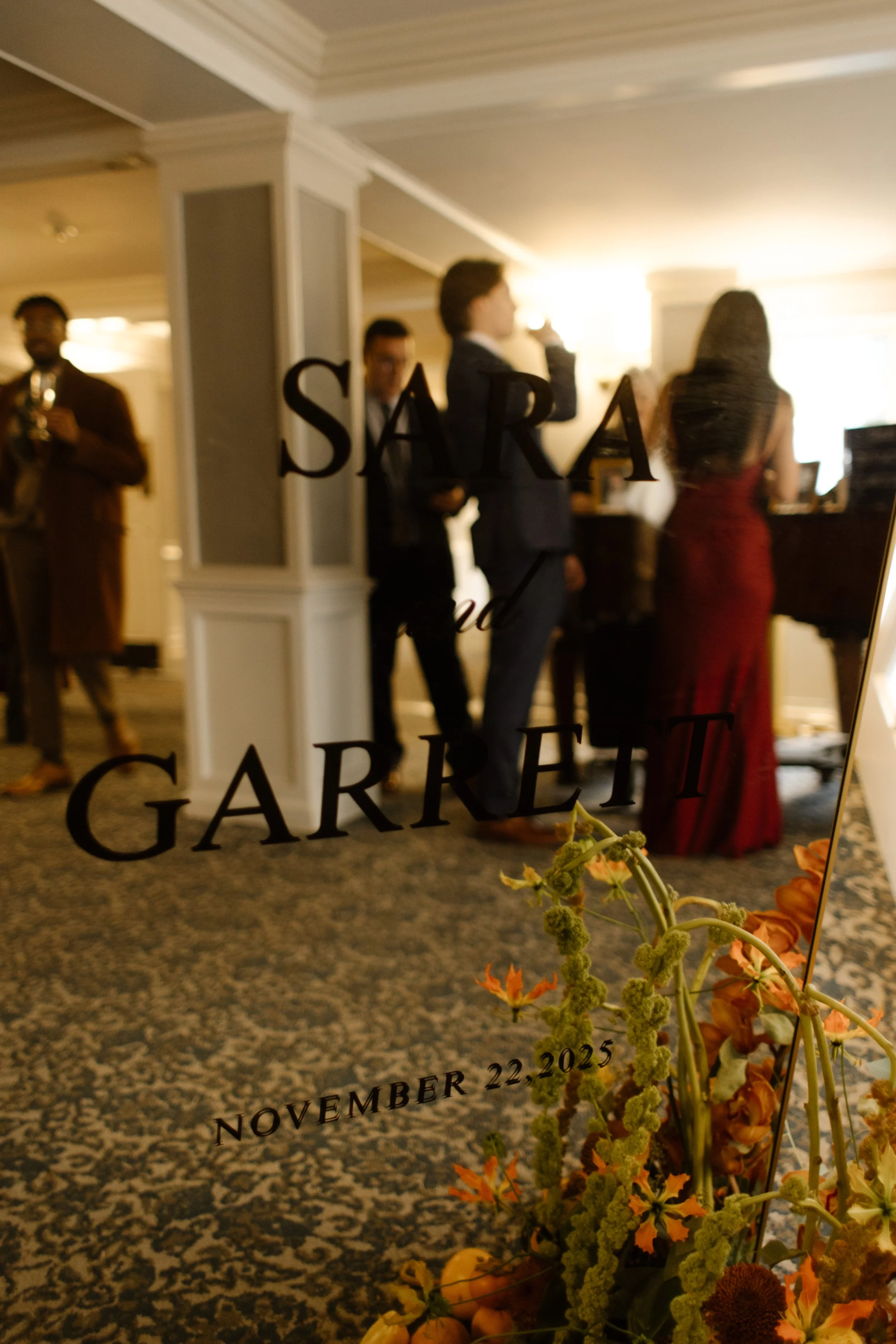Custom welcome sign displaying the couple’s names and wedding date at a wedding in New York reception