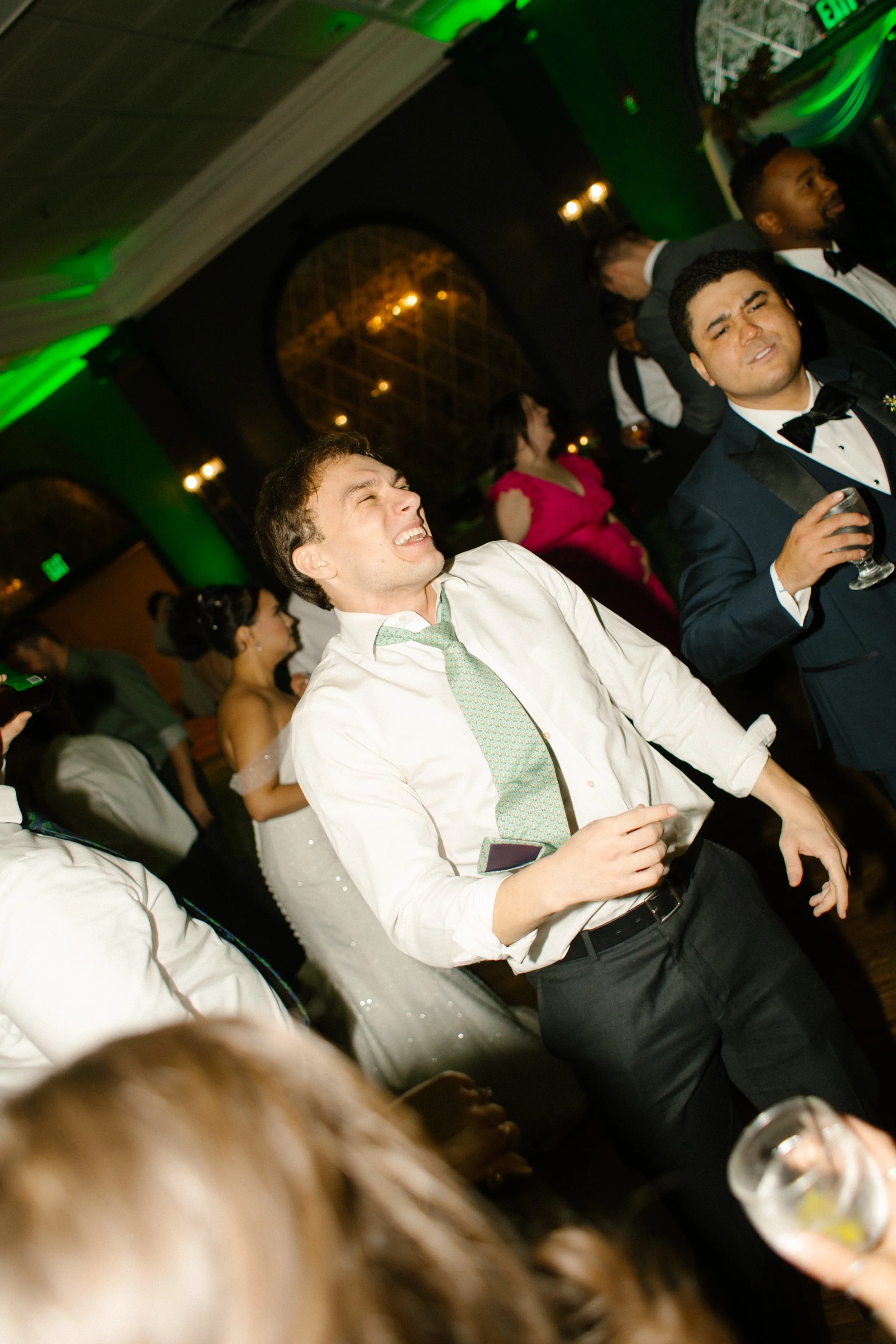 Guests dancing on the reception floor during an energetic wedding in New York celebration