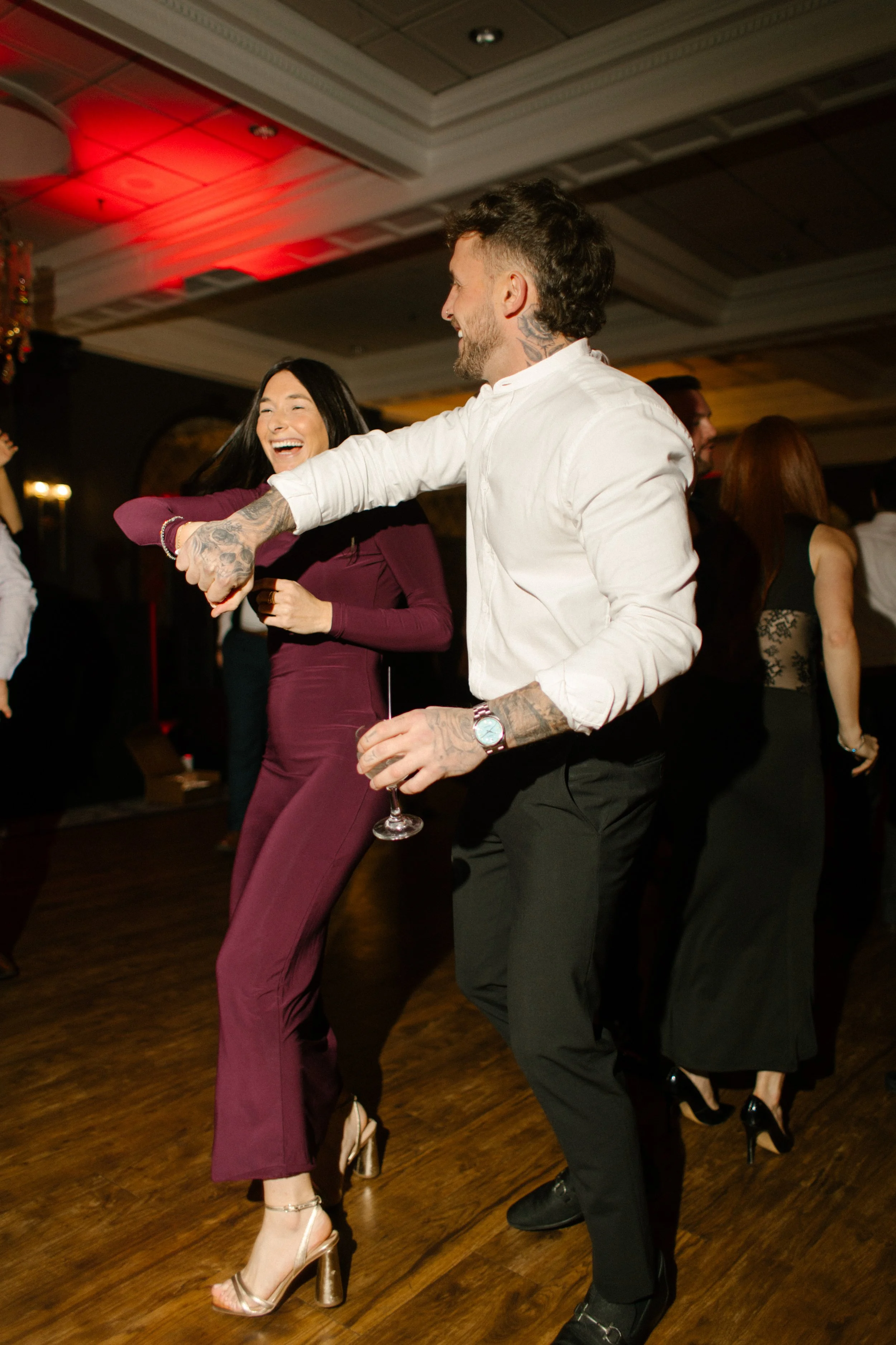 Couple dancing together on the reception floor during a lively wedding in New York celebration