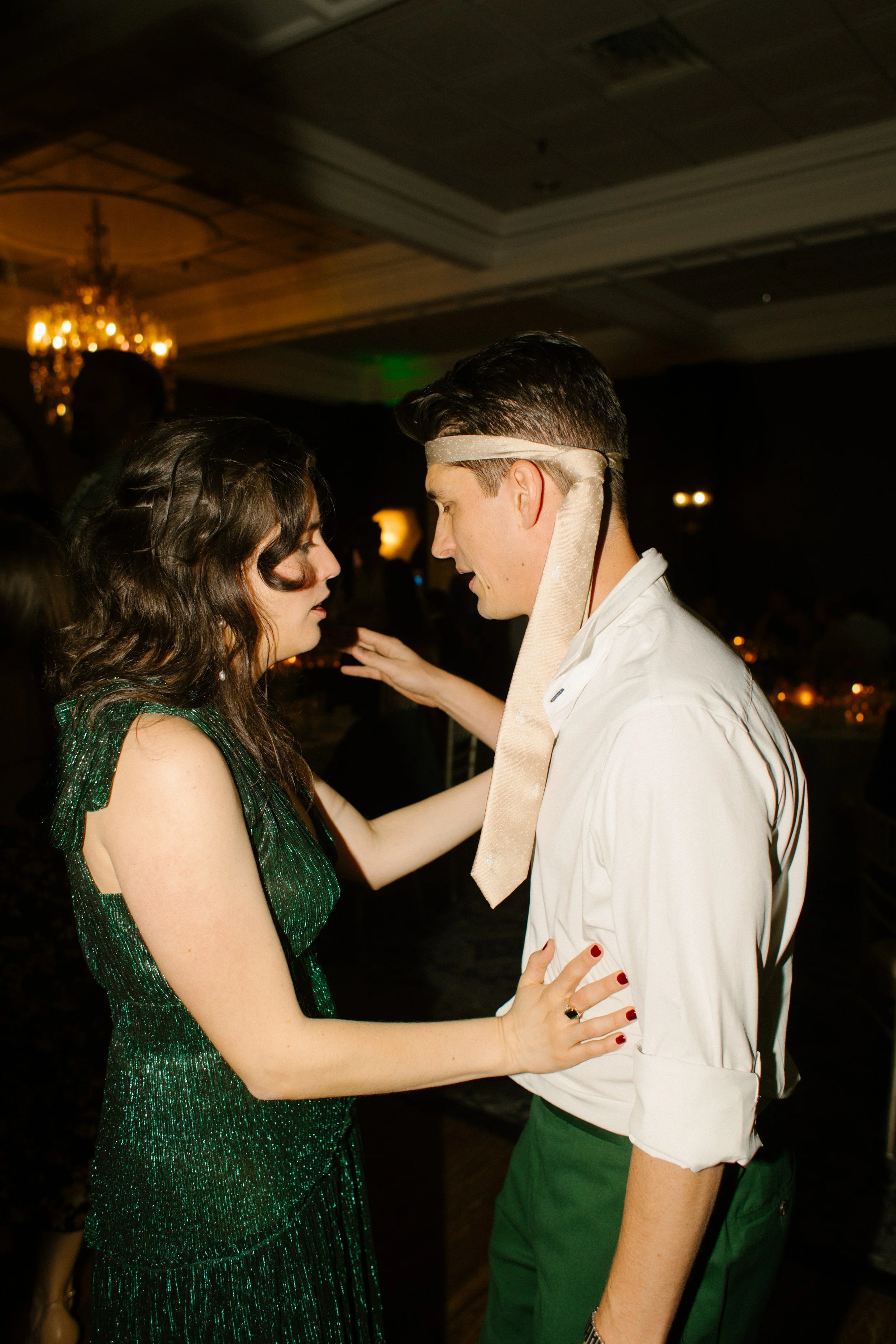 Wedding guests celebrating together on the dance floor during an evening reception