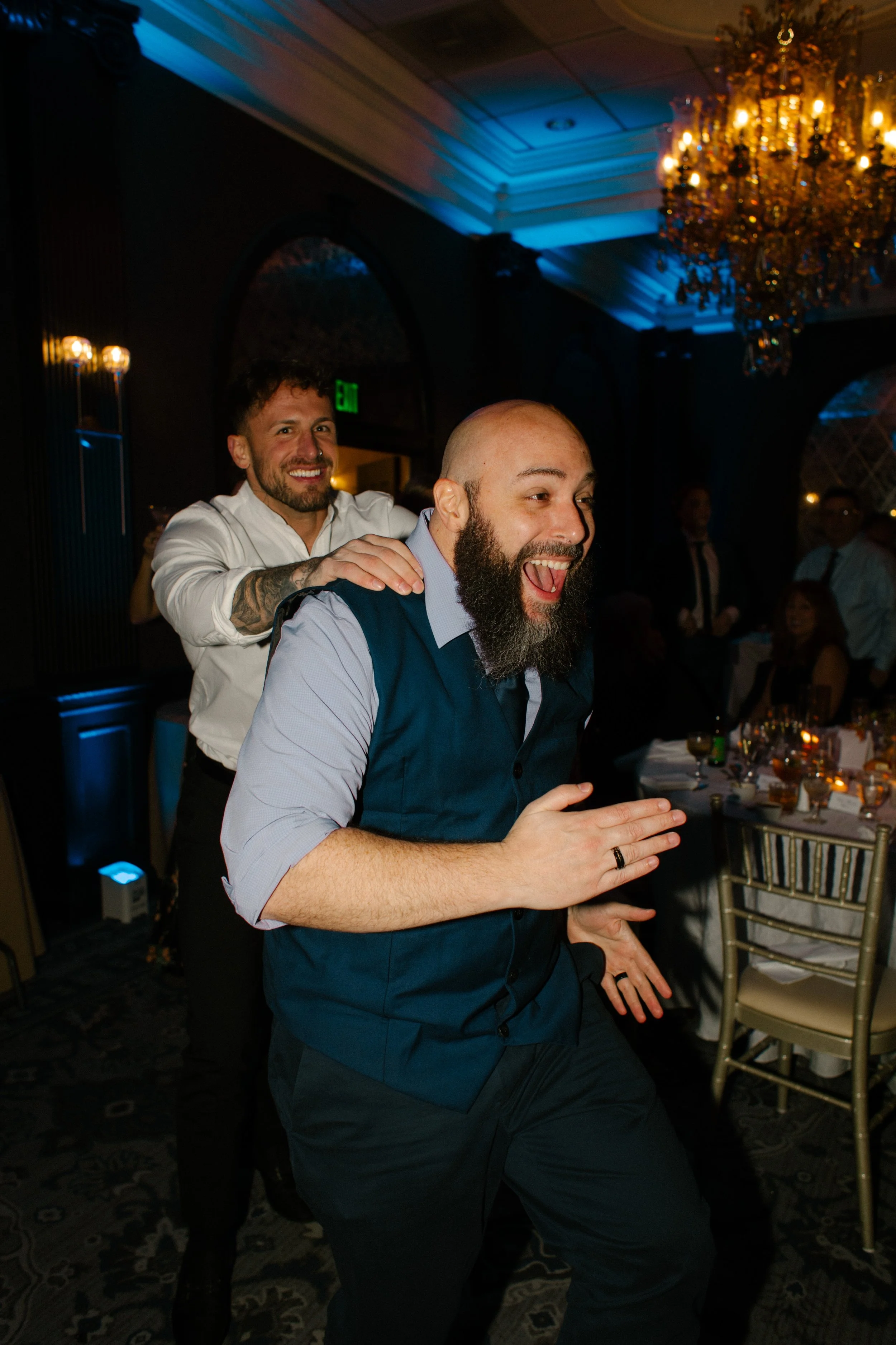 Wedding guest dancing energetically during a lively wedding in New York reception celebration