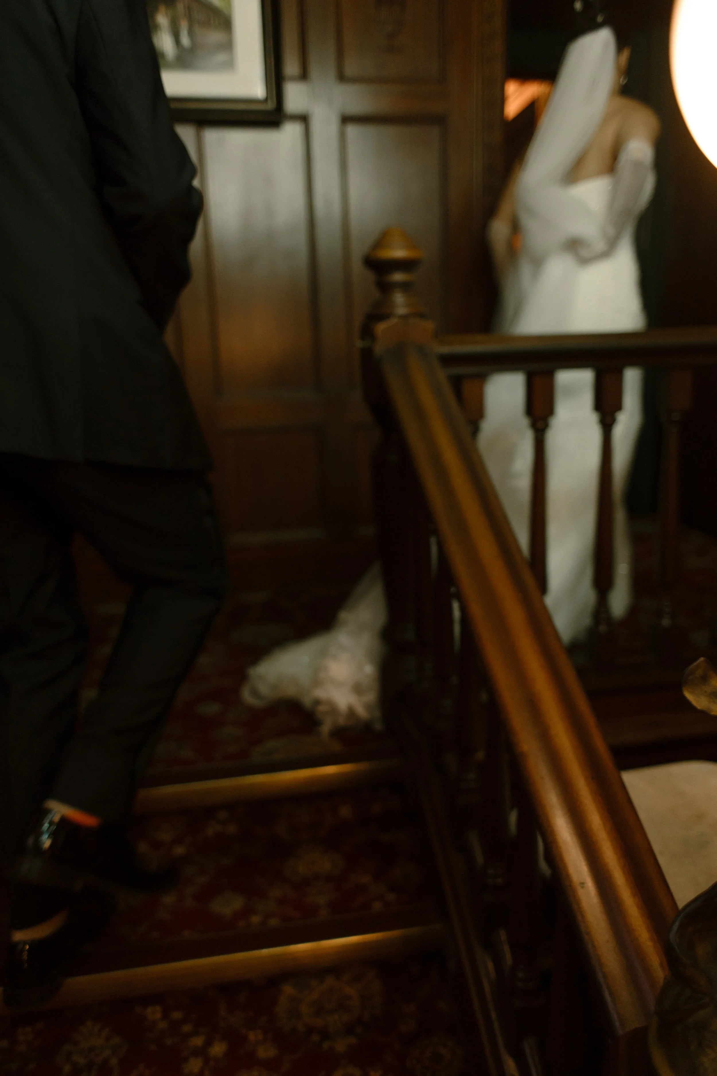 Bride walking through a historic hotel corridor before seeing her groom on the wedding day