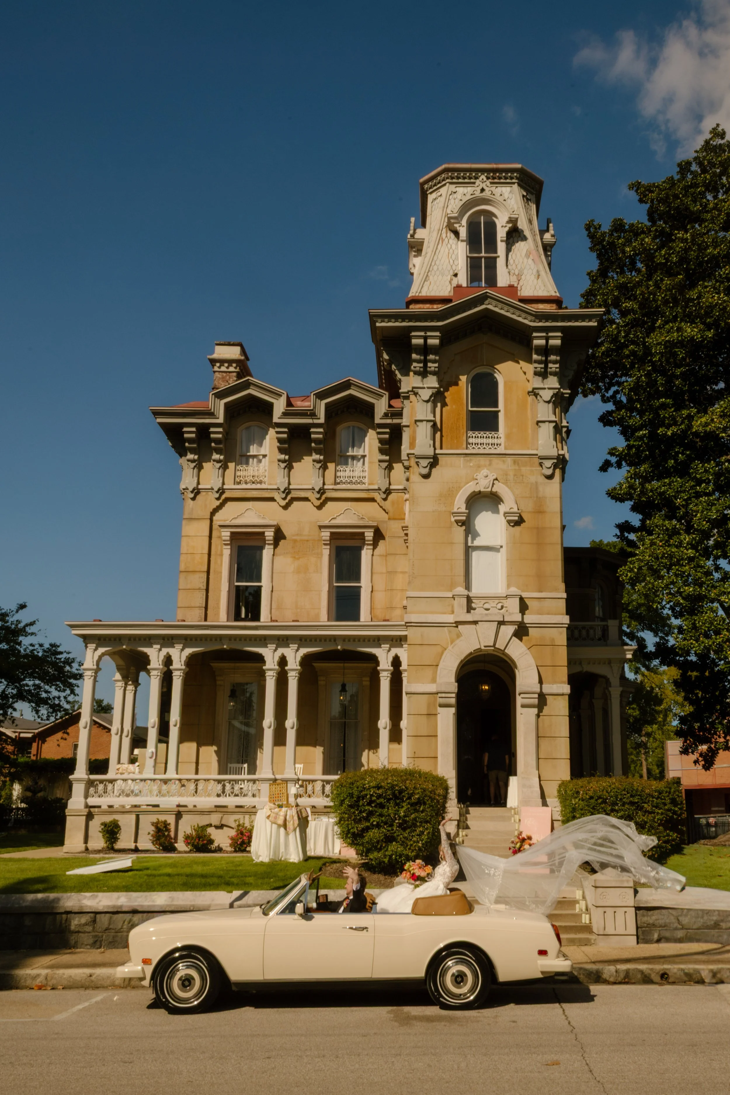 Historic mansion and classic convertible showcasing timeless elements alongside 2027 wedding trends