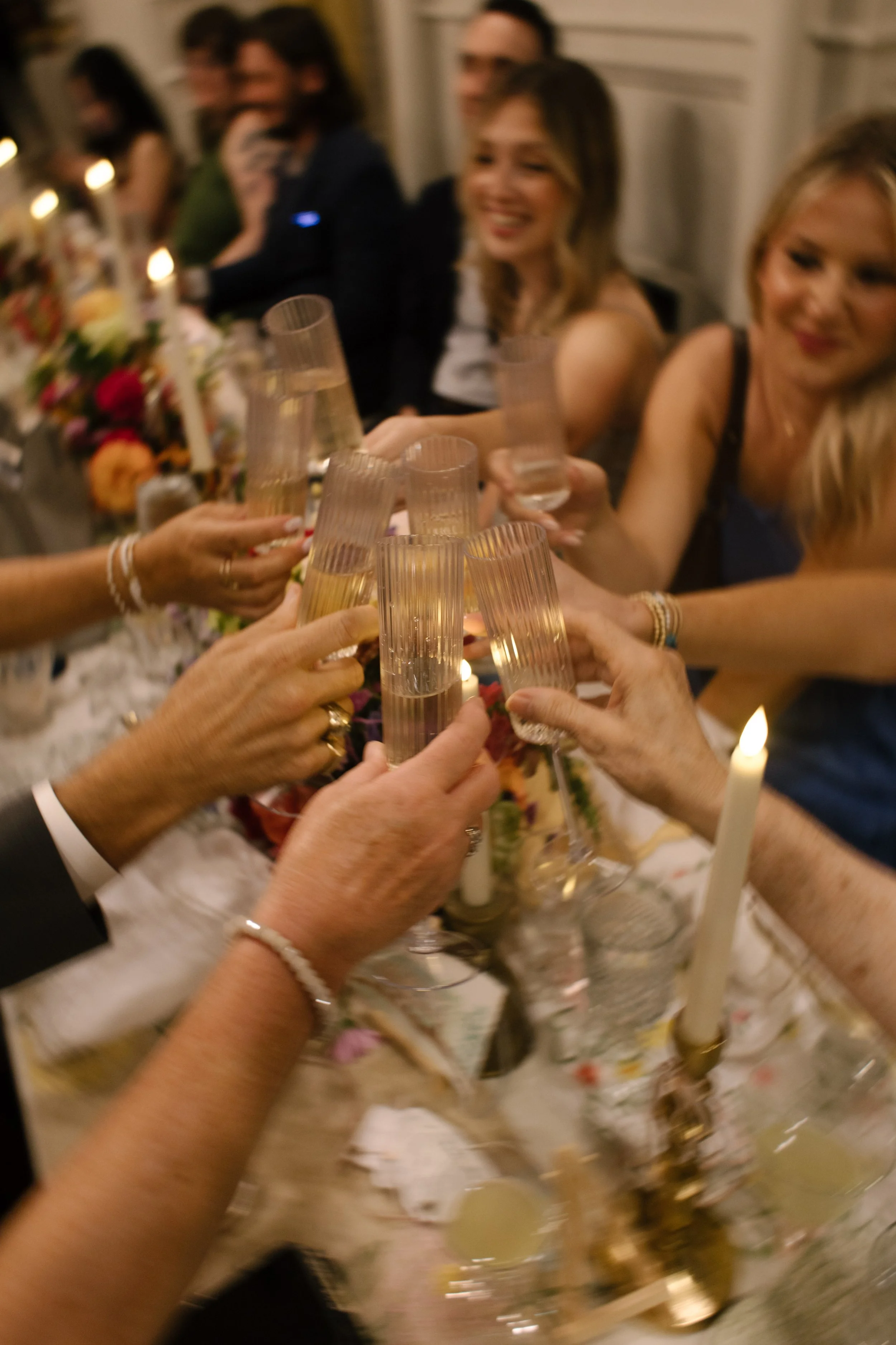 A joyful champagne toast capturing the excitement and connection of an unforgettable wedding celebration