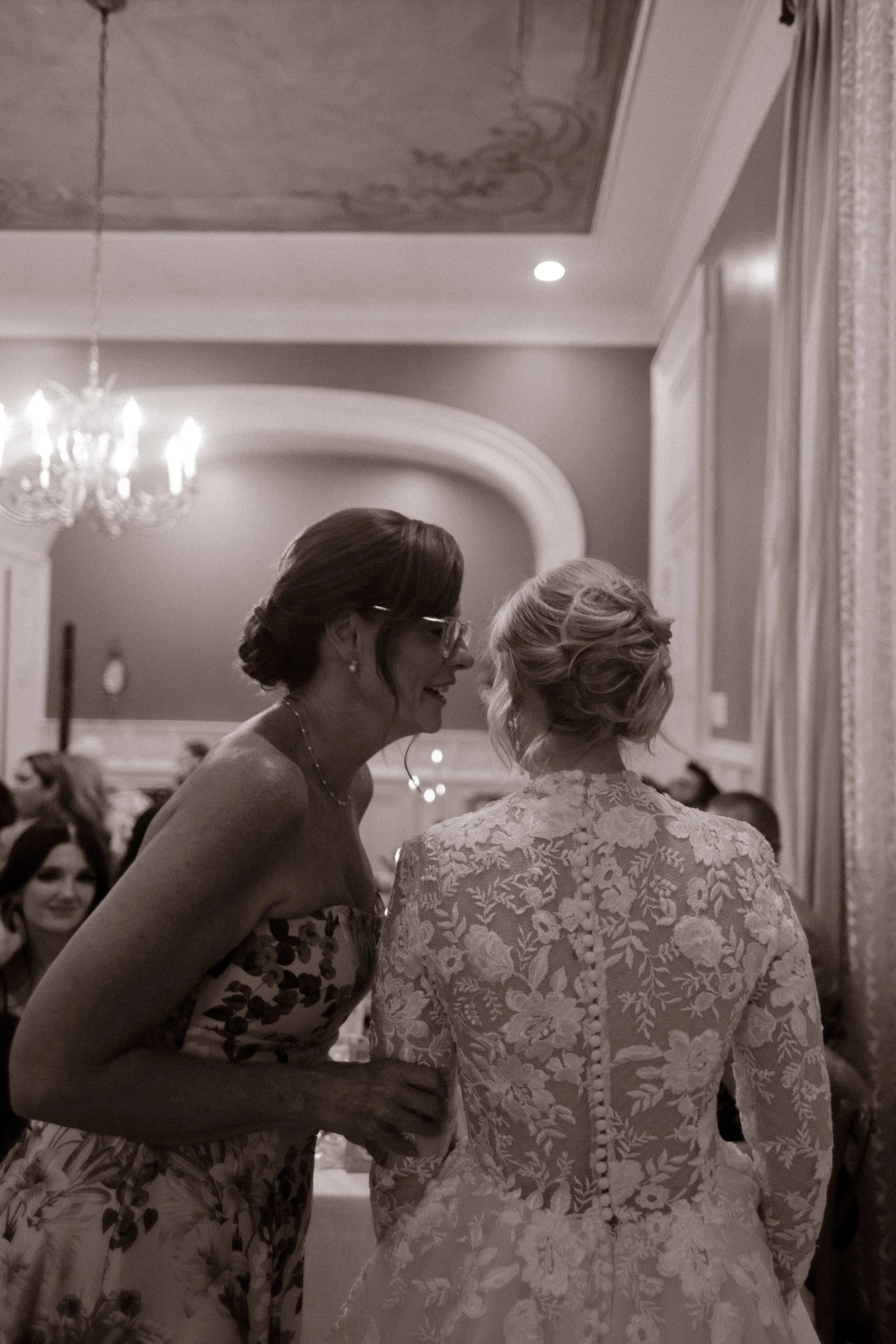 A touching mother-daughter moment during the reception, filled with love, laughter, and meaningful conversation