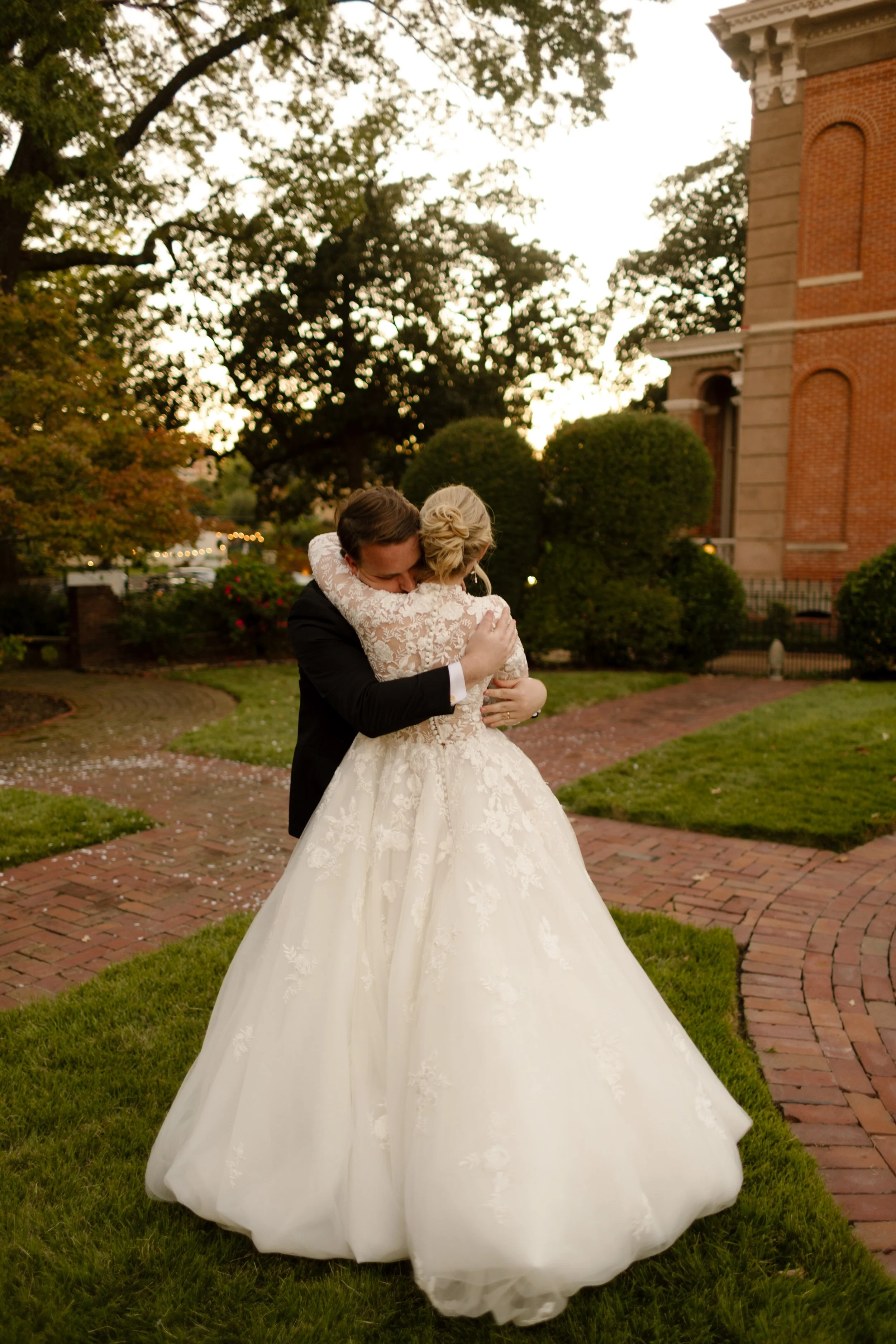 A quiet embrace between newlyweds after the ceremony, capturing the emotion and beauty of the day