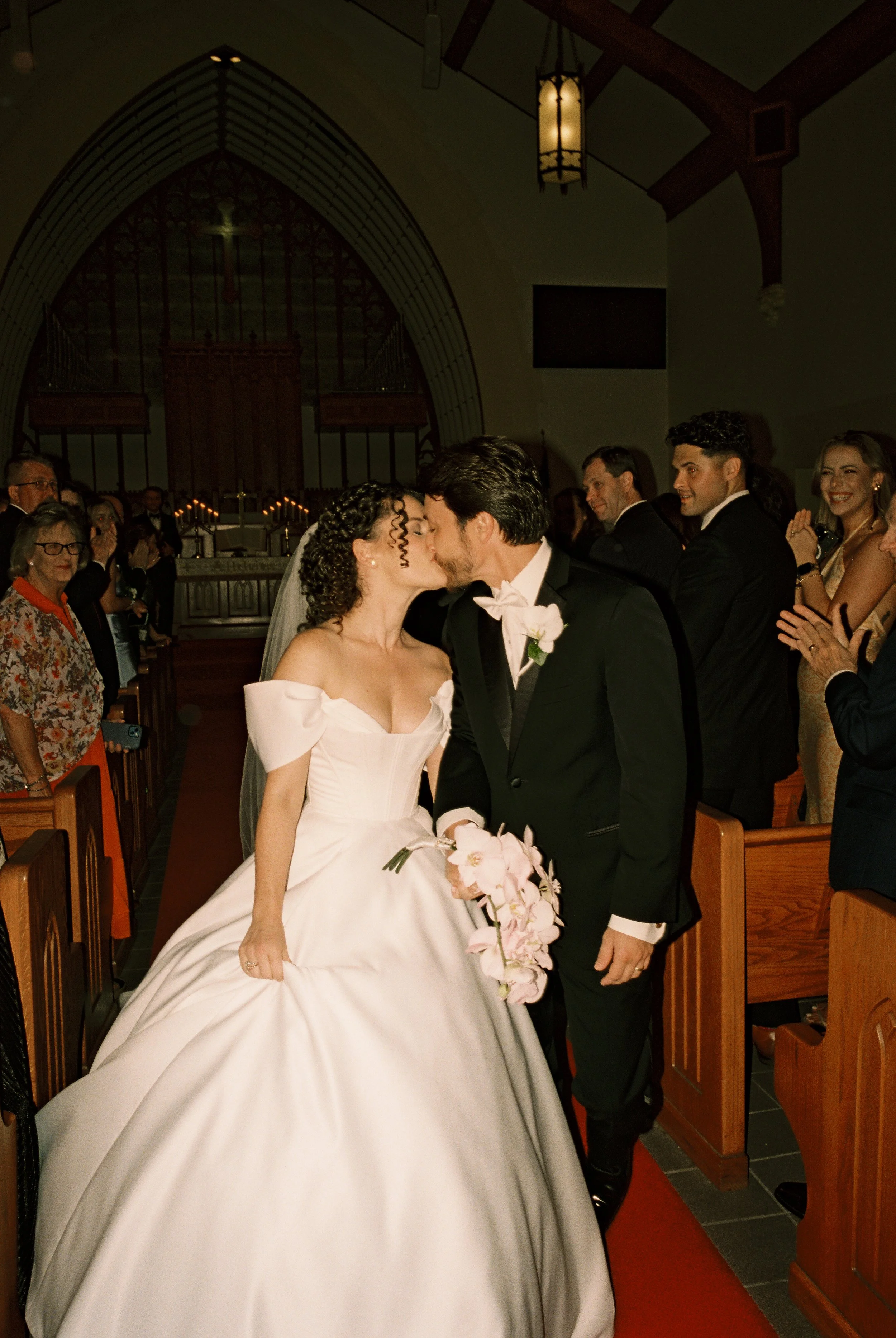 Couple exchanges vows at the altar during a traditional church wedding ceremony.