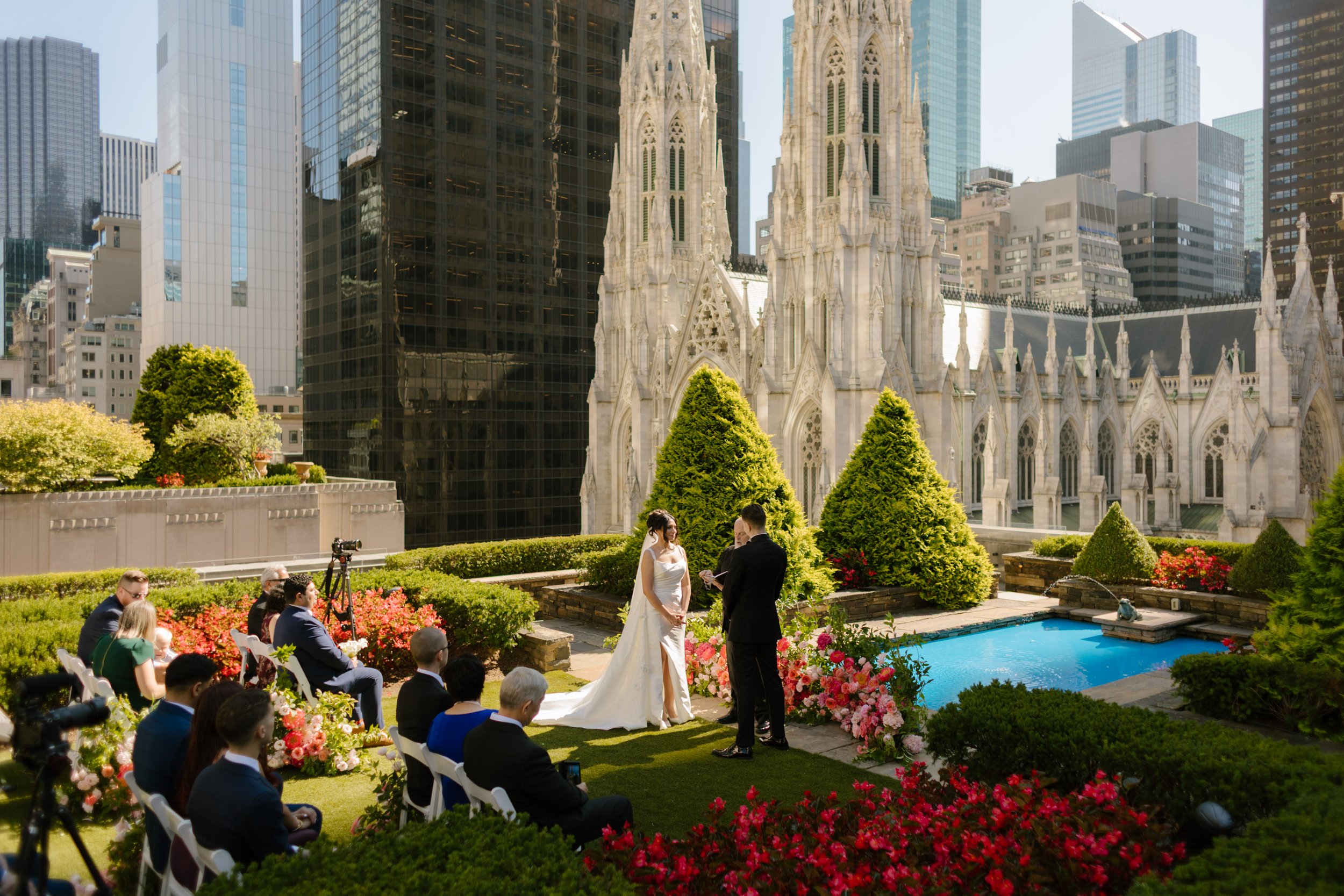 Couple exchanges vows on a rooftop overlooking St. Patrick's Cathedral, one of the most iconic Wedding Locations in NYC.