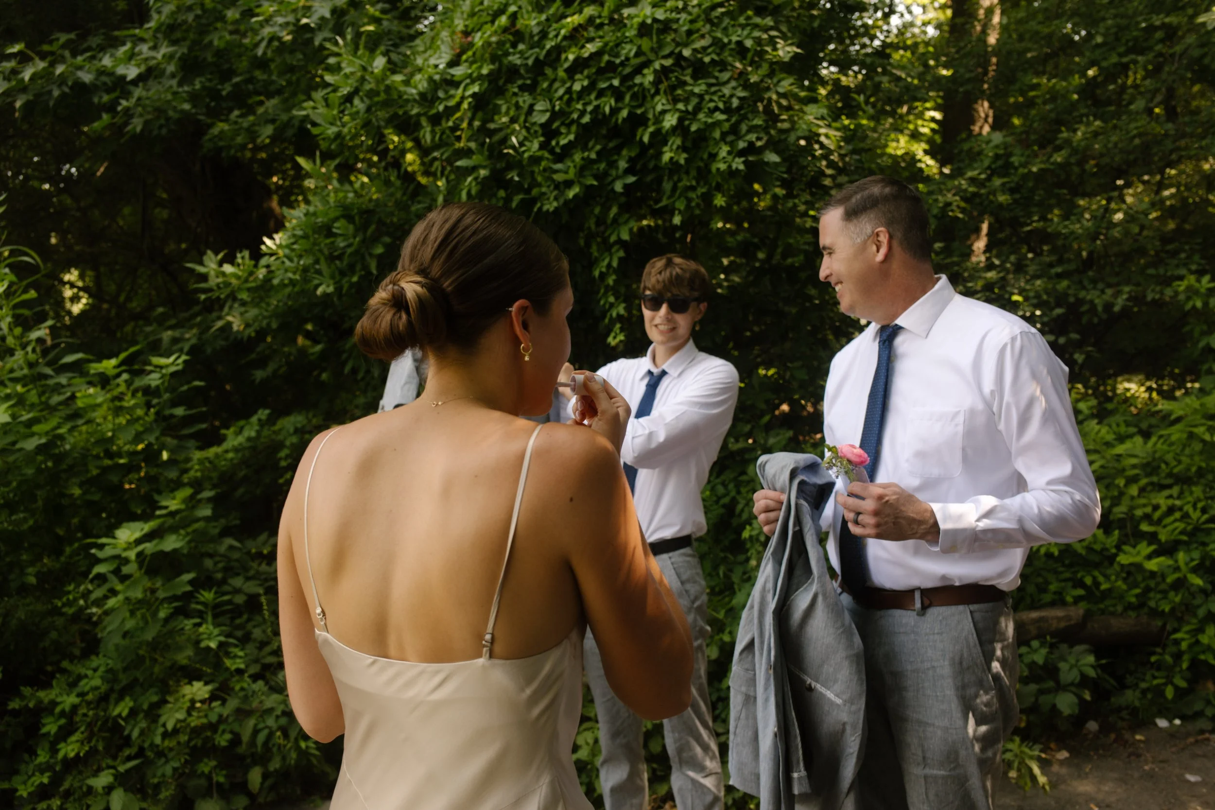 Bride talking with wedding guests before the ceremony begins in Central Park.