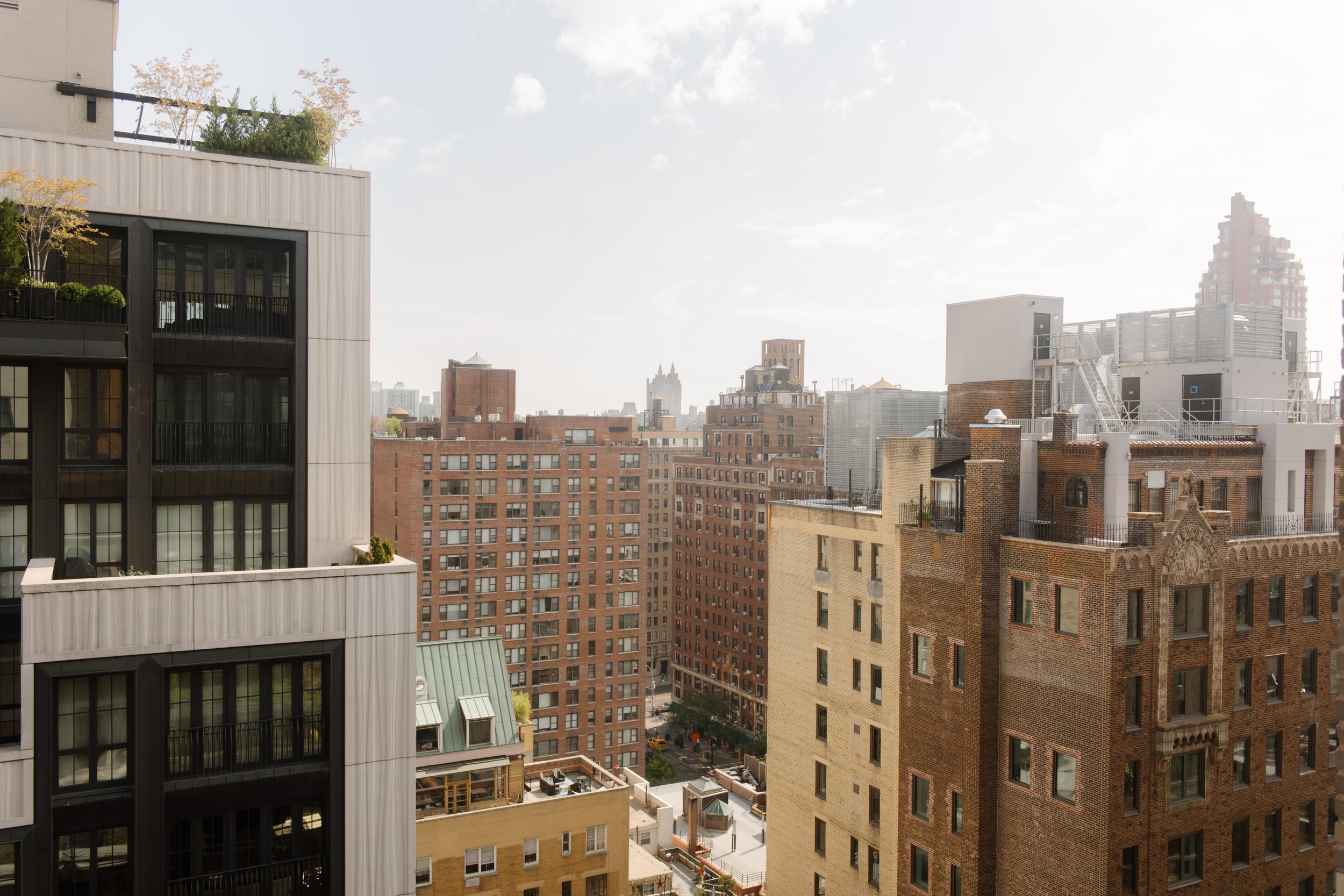 Manhattan skyline and surrounding architecture viewed from a hotel room in NYC.