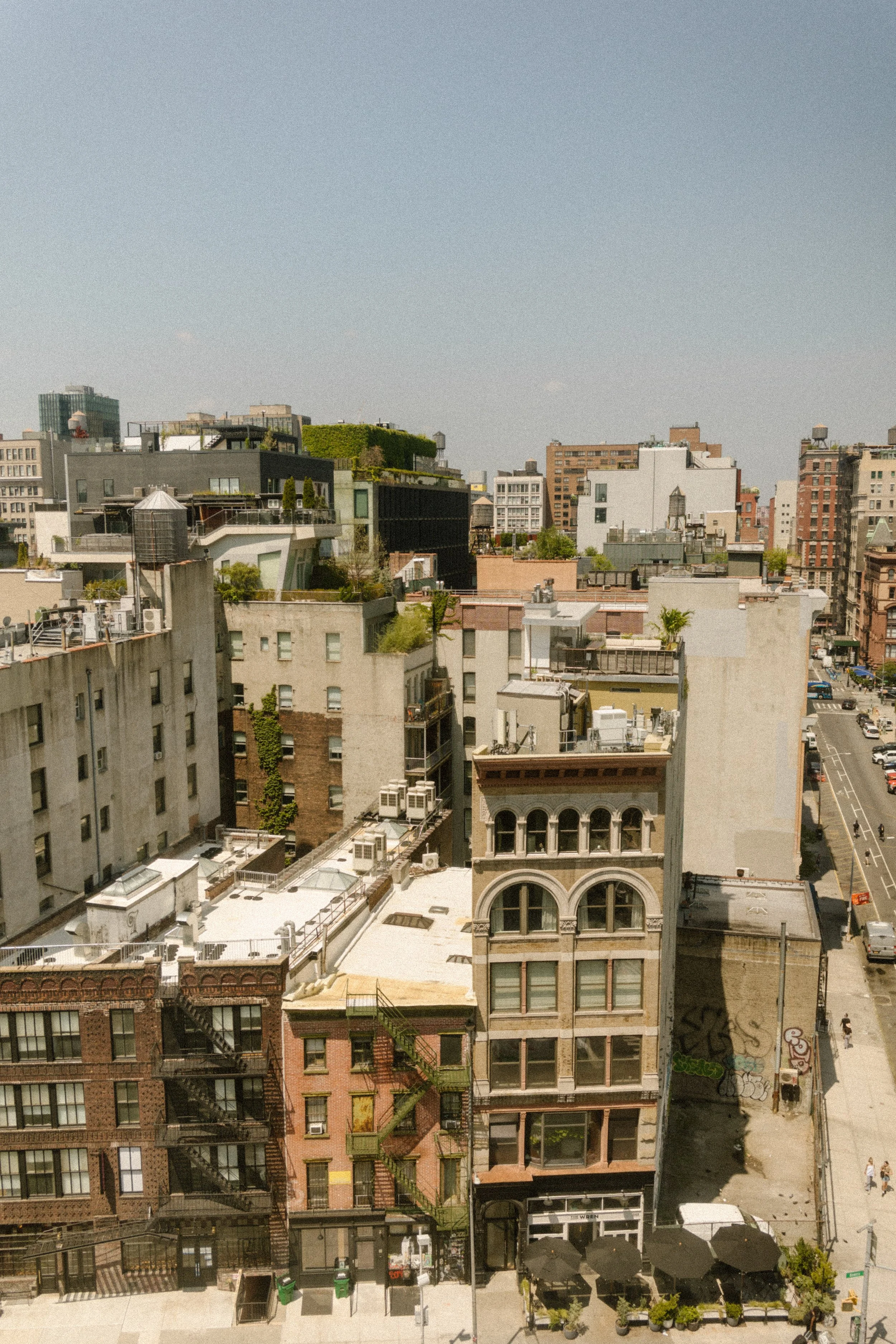Elevated view of Manhattan rooftops, historic buildings and streets from a NYC hotel.