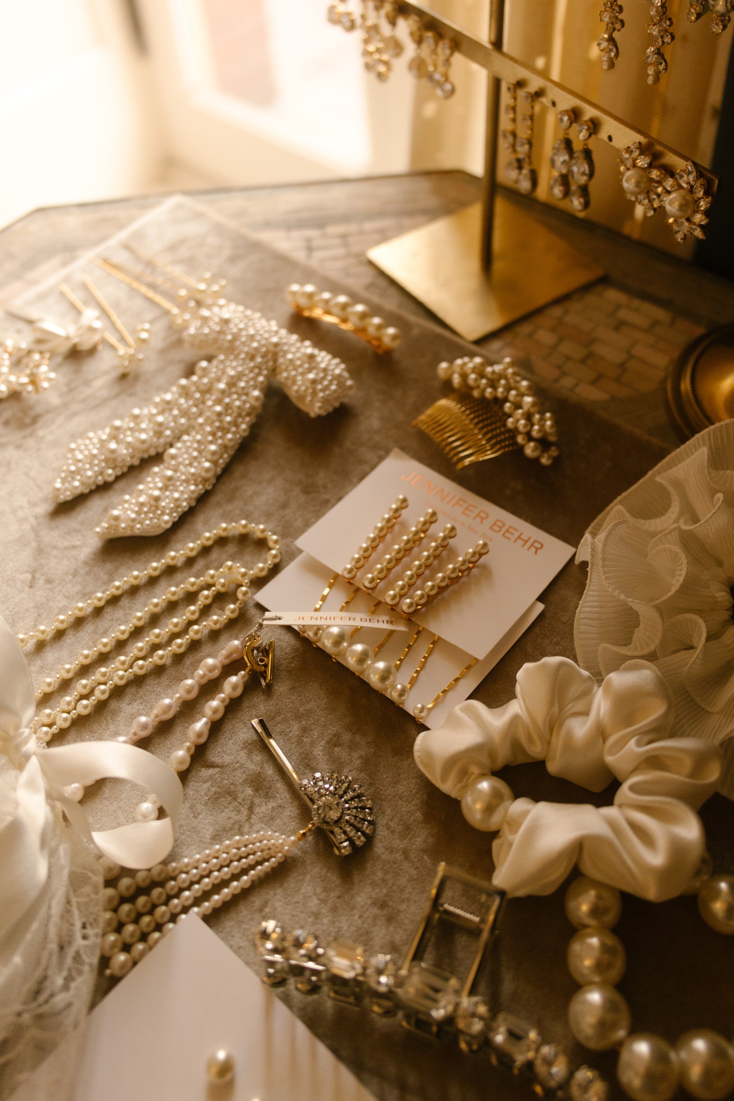 Bridal accessories, pearl jewelry, and wedding details carefully arranged inside one of the elegant NYC hotels.