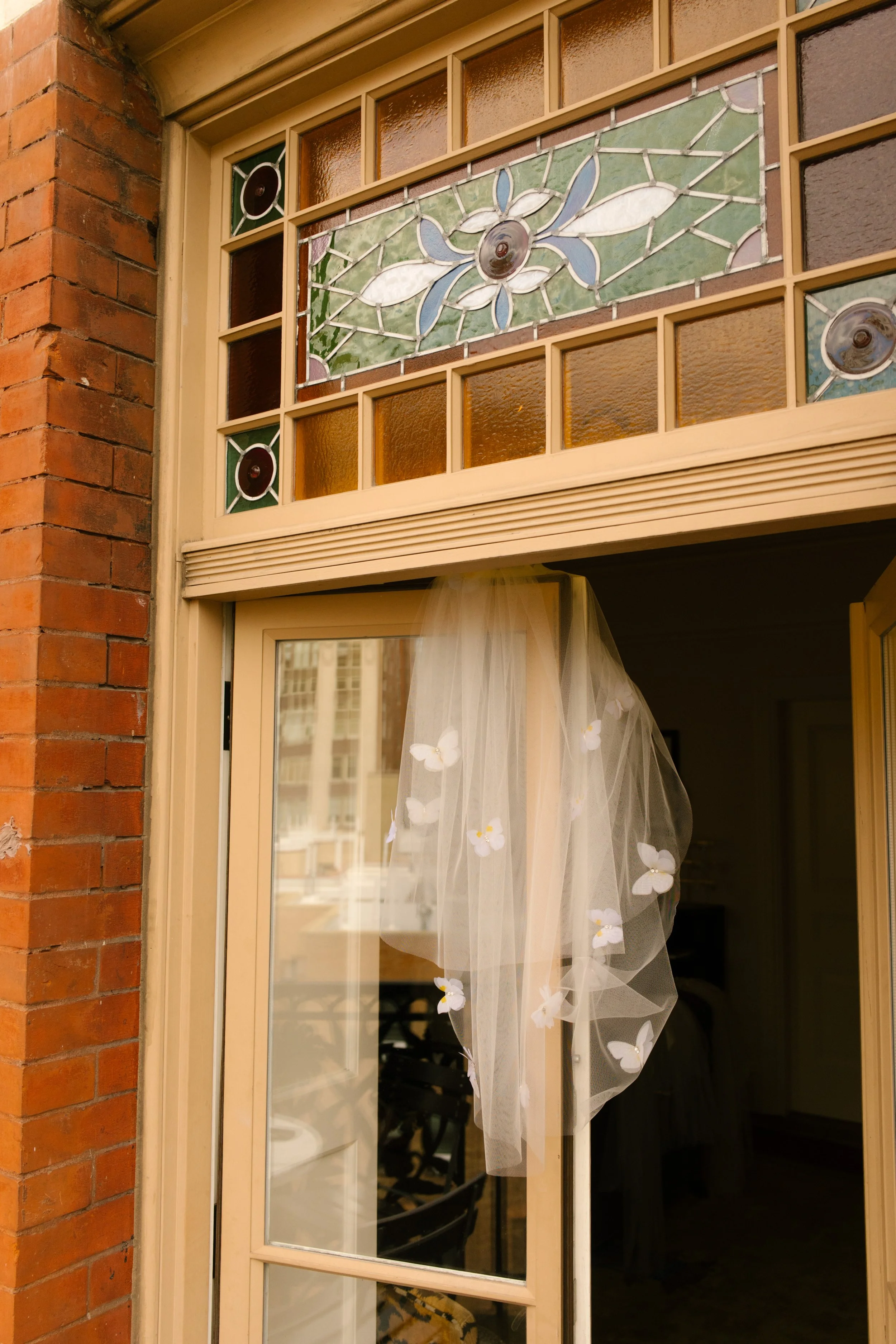 Bridal veil hanging in the doorway of a historic New York hotel before the wedding ceremony.