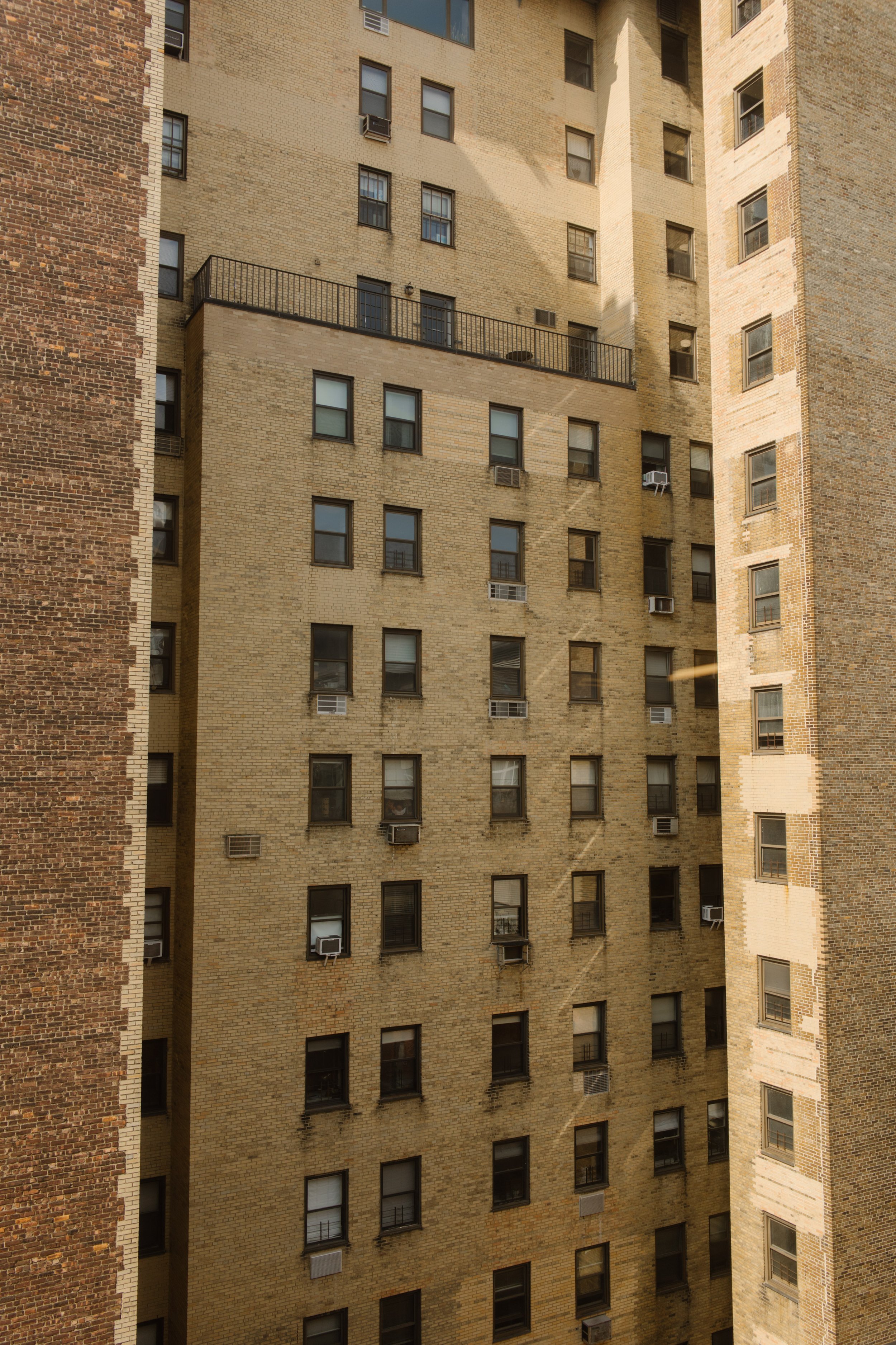 View of neighboring brick buildings from a window at one of the NYC hotels.