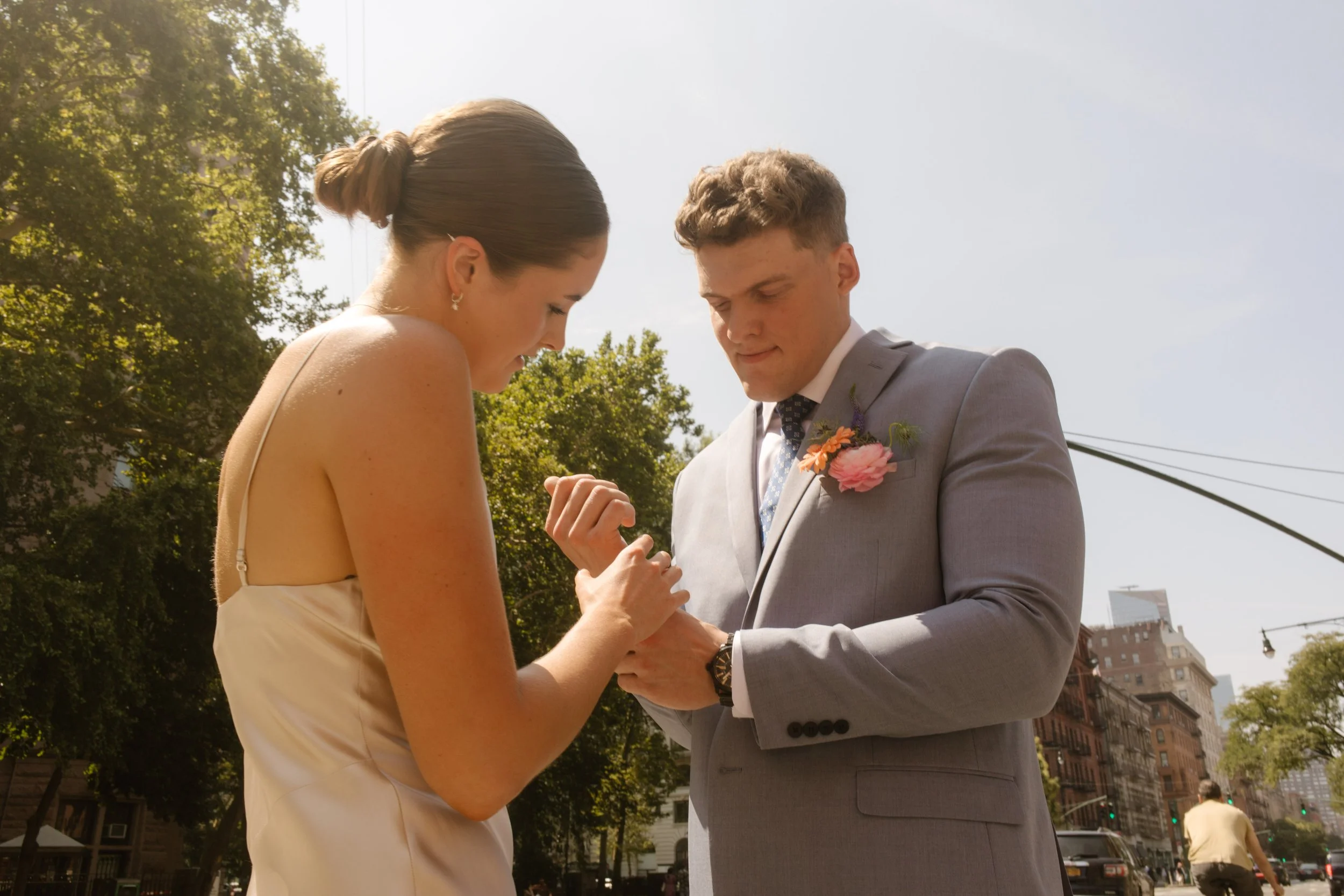 Multi-Day Destination Wedding couple exchanging rings outdoors during an intimate New York City wedding ceremony