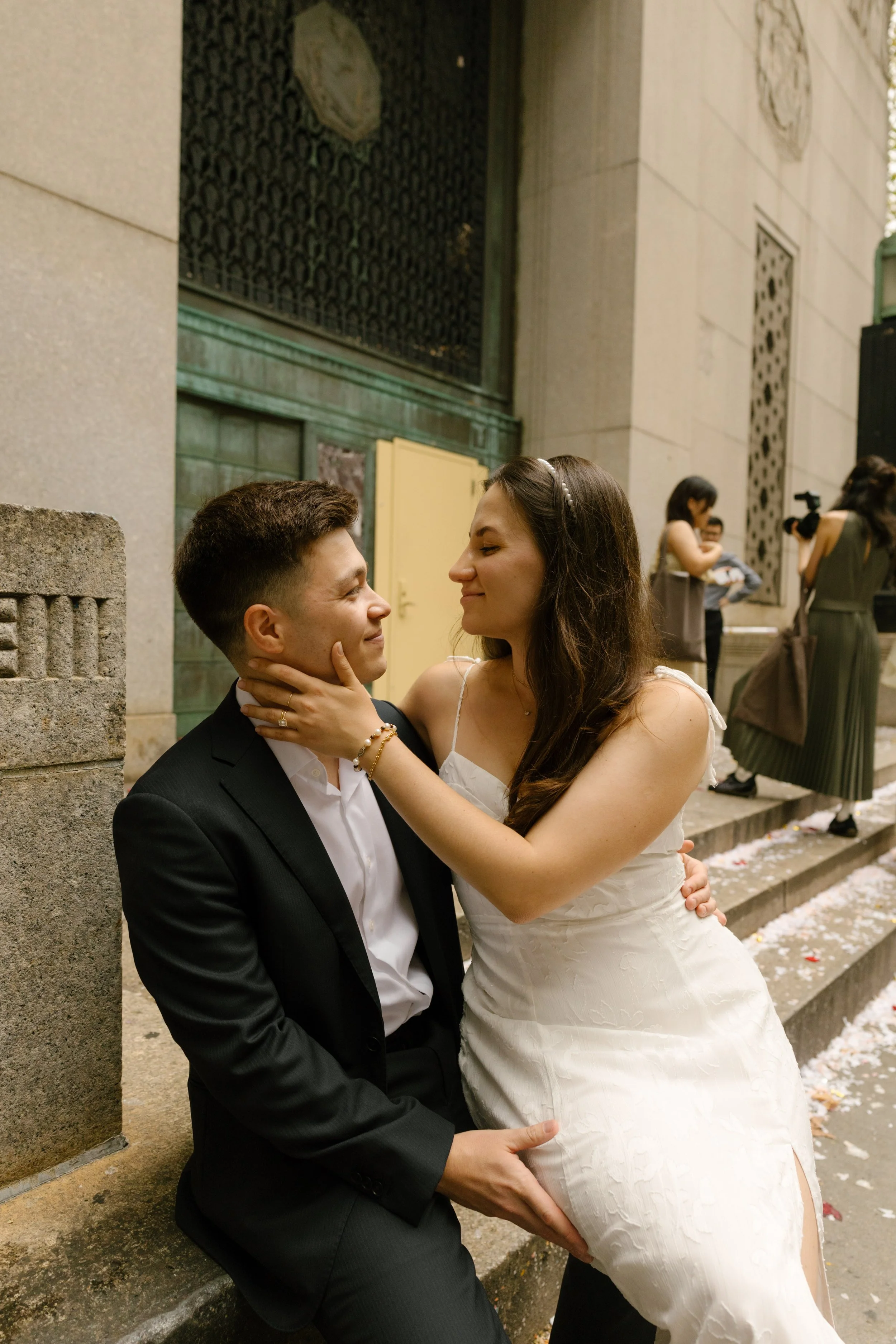 New York City courthouse wedding couple sharing a quiet moment on the courthouse steps after getting married