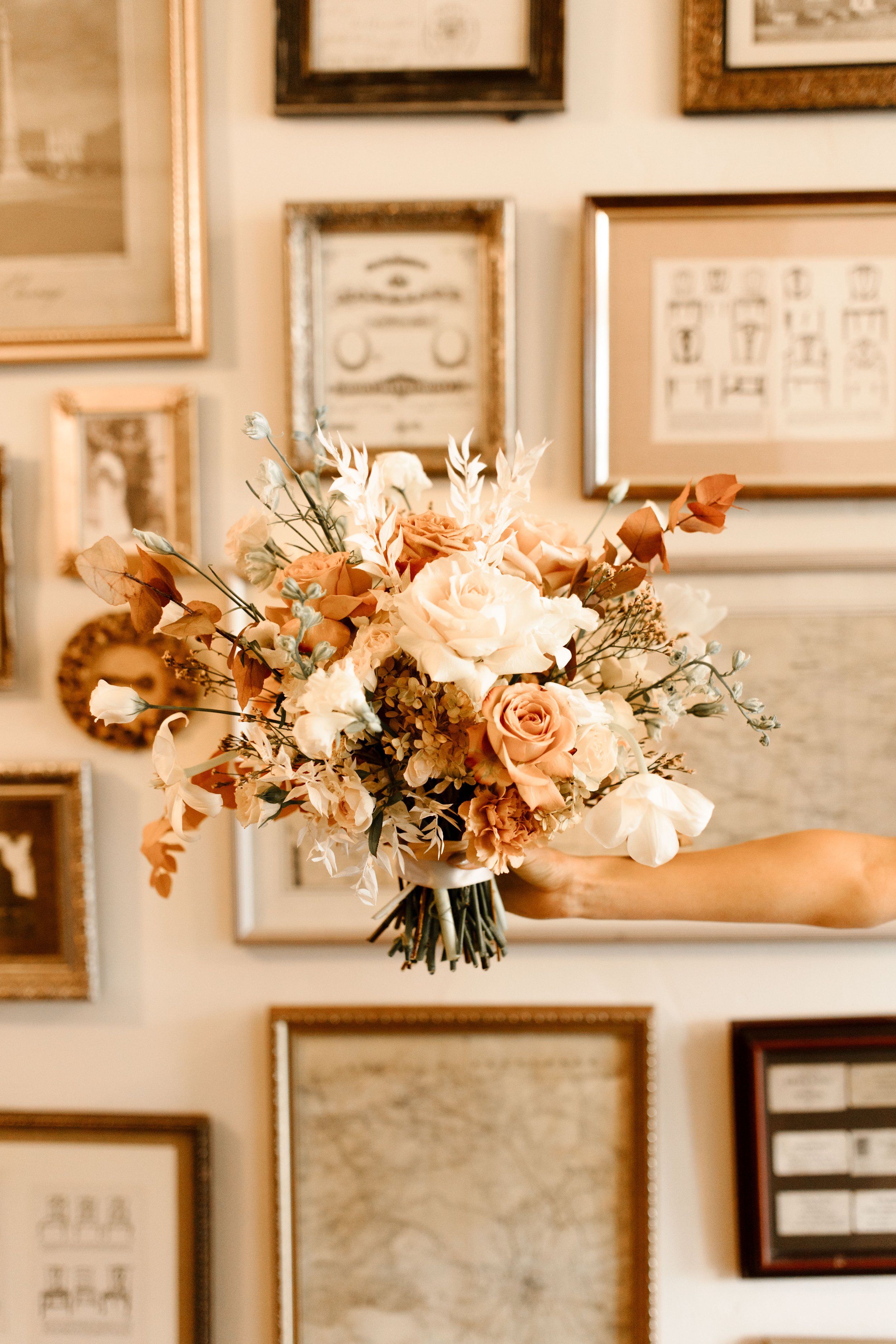 Peach, cream, and dried floral bridal bouquet with warm seasonal tones for a romantic fall wedding.