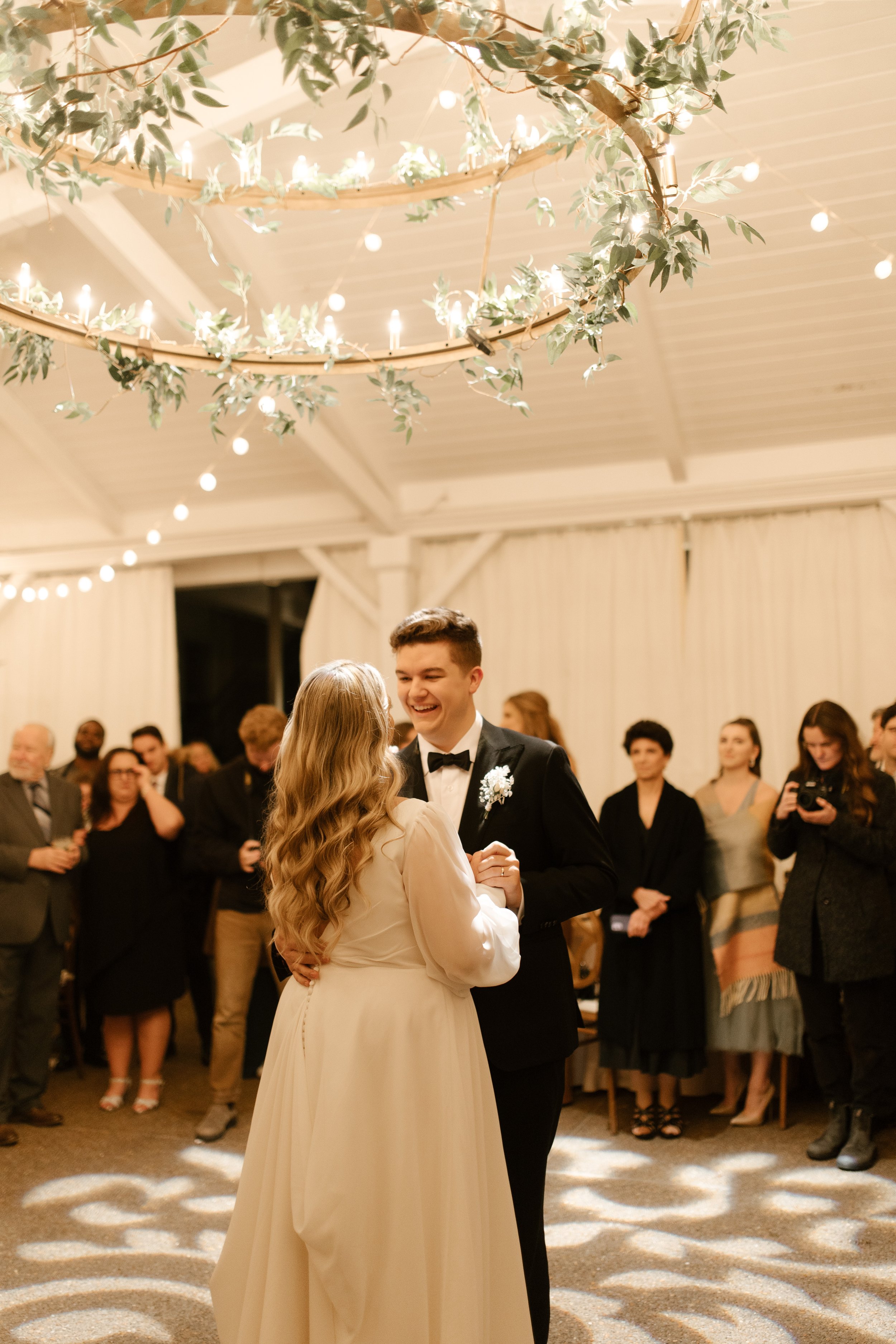 Bride and groom sharing a quiet moment together on the dance floor during their fall wedding reception.