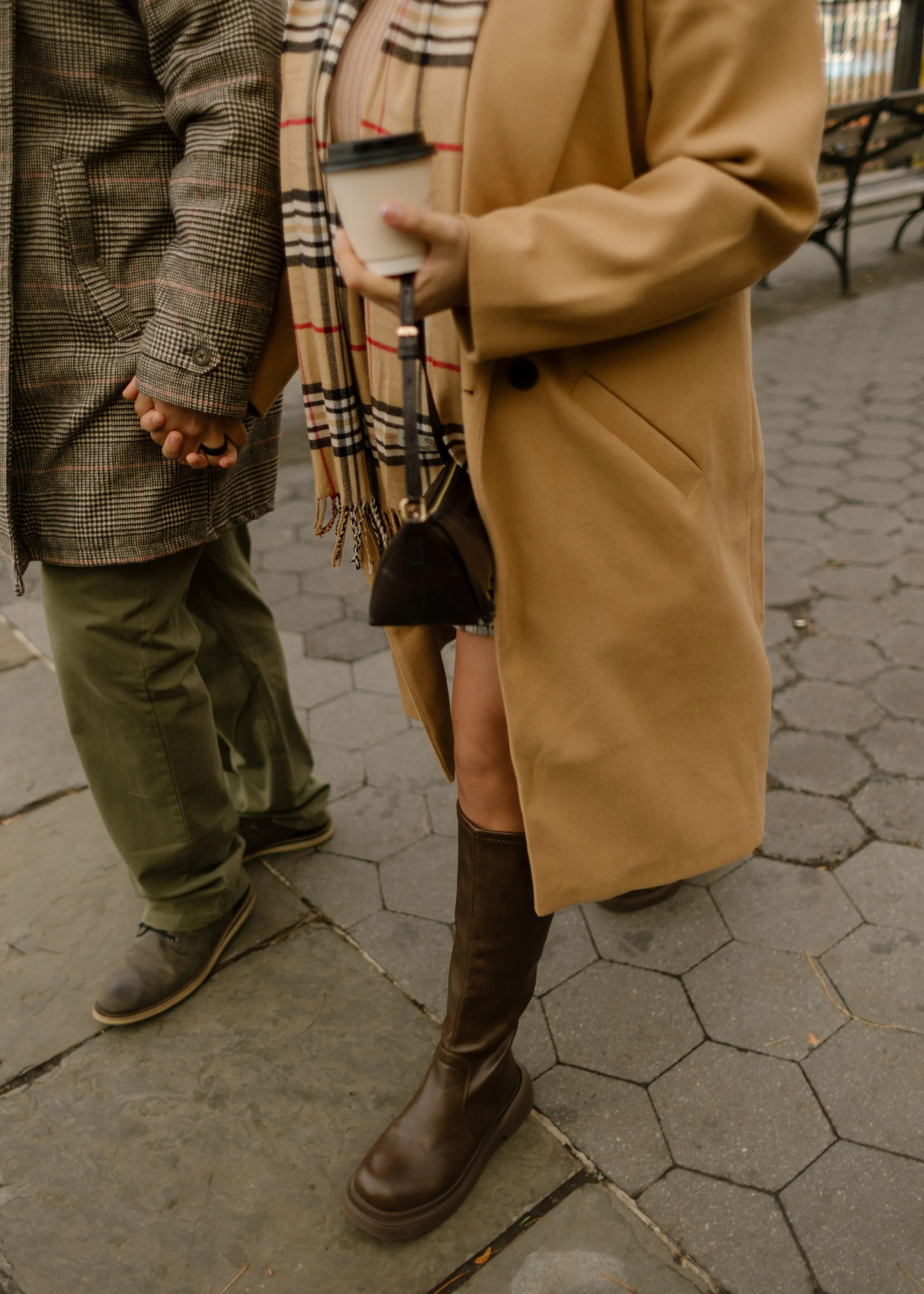 Brooklyn engagement photos featuring fall outfits, coffee, and a candid hand-holding moment while walking through the neighborhood.