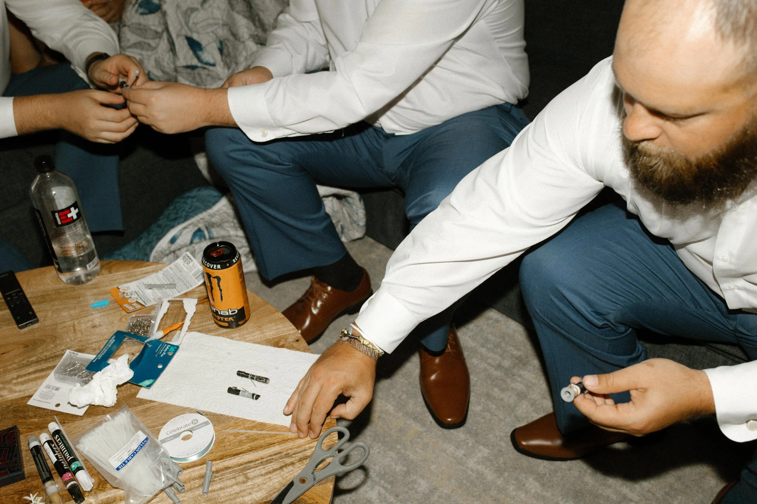 Groomsmen sharing a chaotic, hilarious behind-the-scenes moment while getting ready during the wedding weekend.