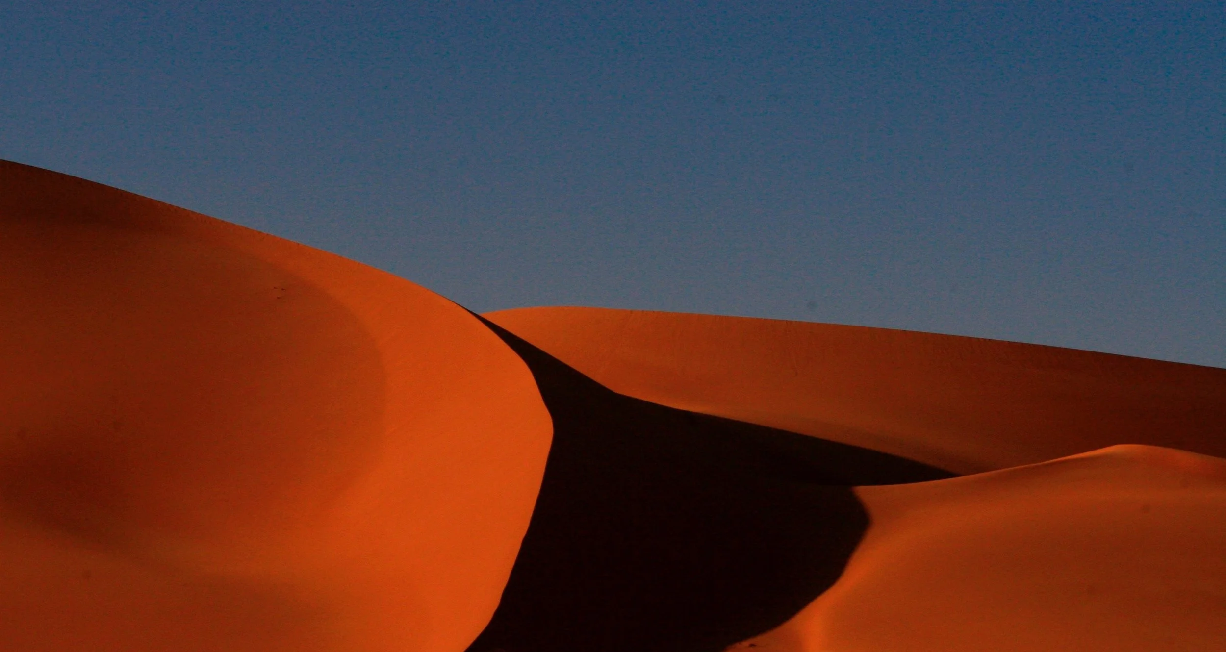 Dunes in Murzuq, Libya, Photo by Audrius Sutkus on Unsplash .