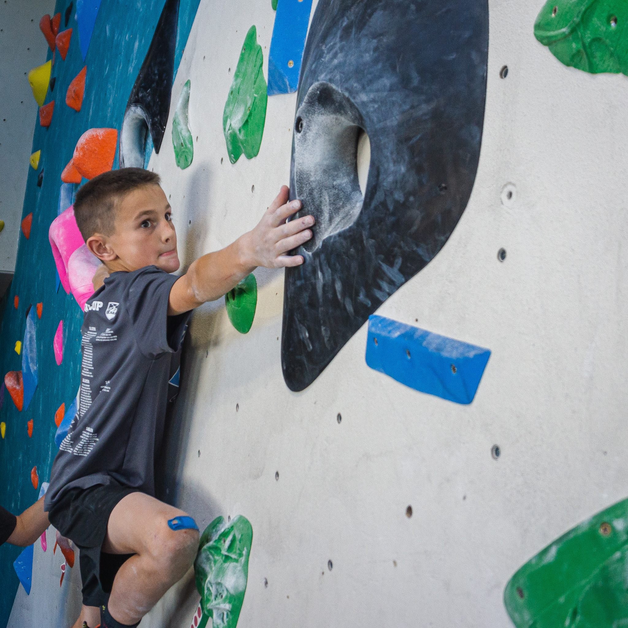Boy rock climbing in an after-school club at The Spot Golden.jpg