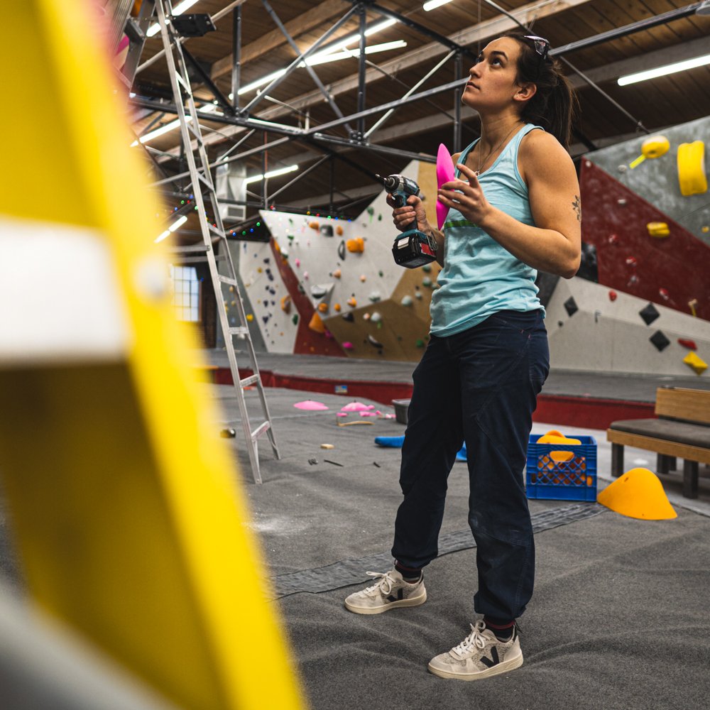 Woman Routesetting at The Spot Bouldering Gym in Denver Colorado.jpg