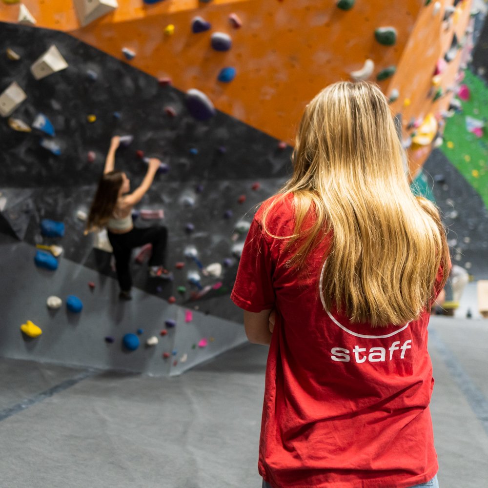 Friendly Coach teaching Climbing Club at The Spot Louisville.jpg