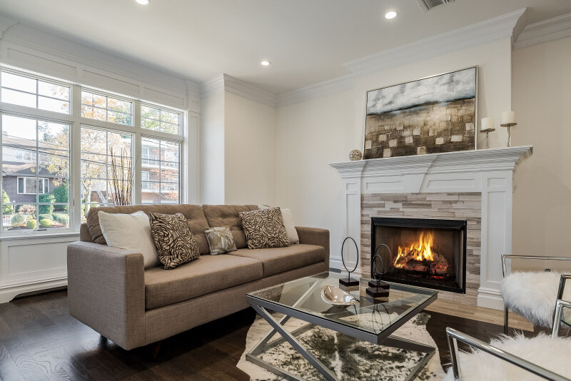 living room fort lee nj professional home staging brown sofa stone fireplace art mantle.jpg