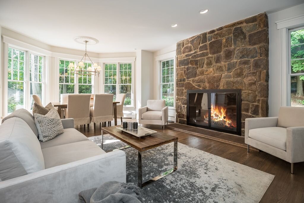 spaces that speak home staging mahwah nj living room dining stone fireplace modern furniture elegant.jpg