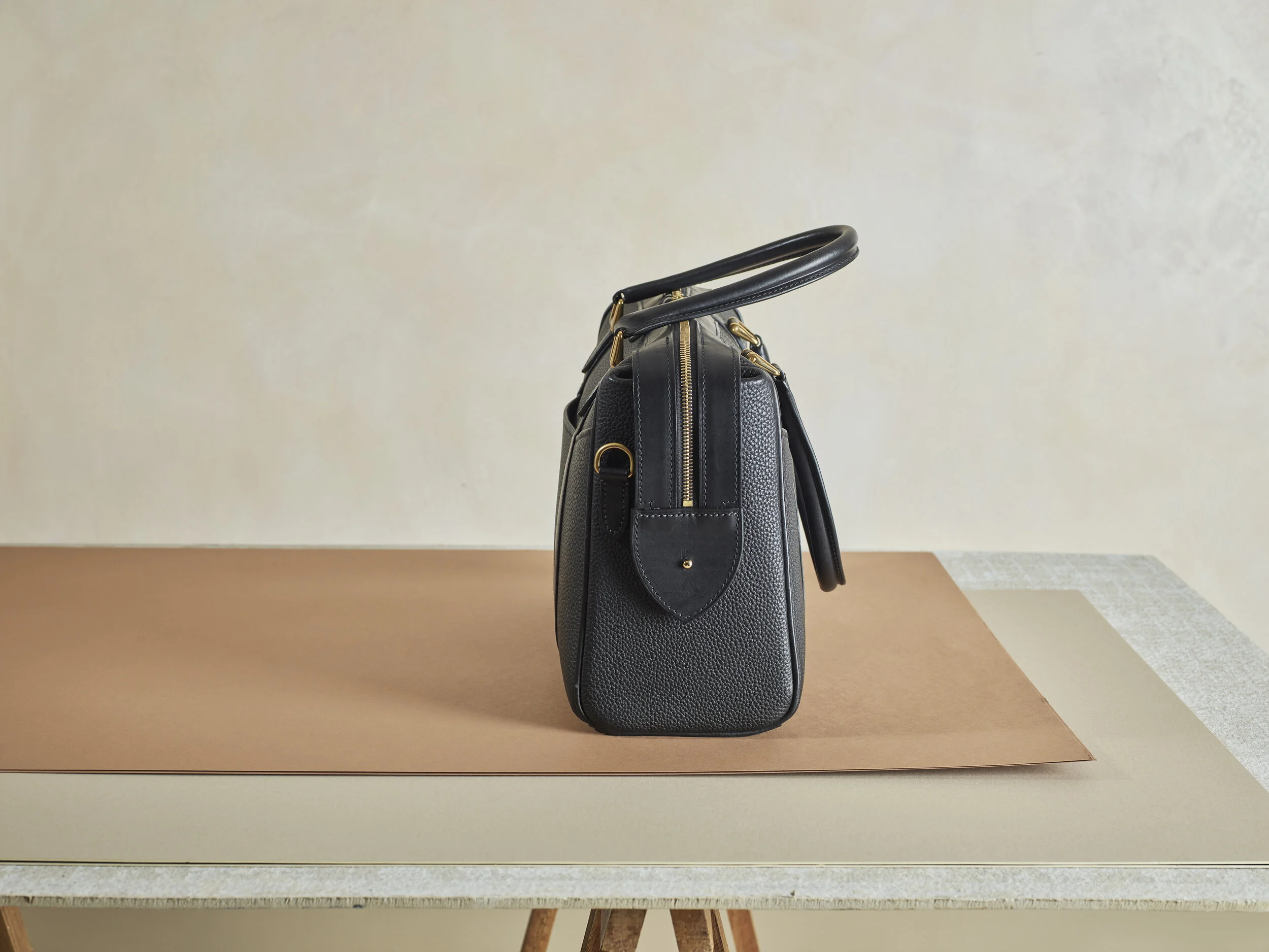 Handmade black leather handbag from a bespoke commission by Charles Laurie London