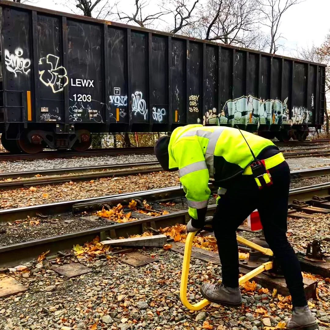 A New York and Atlantic employee throws a switch at the company’s tracks in Glendale, Queens.