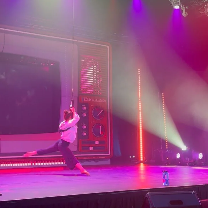 Sometimes we have to do tech rehearsals on the same day as regular rehearsals or shows. To spare my scalp and eliminate overtraining, I sometimes use a sling to mine my choreography. It&rsquo;s not perfect but it works! Here you can see how sling reh