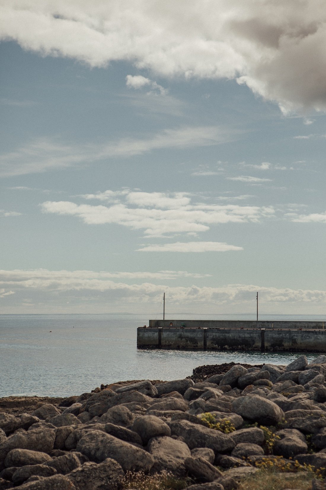 A stone jetty just into clear Irish water