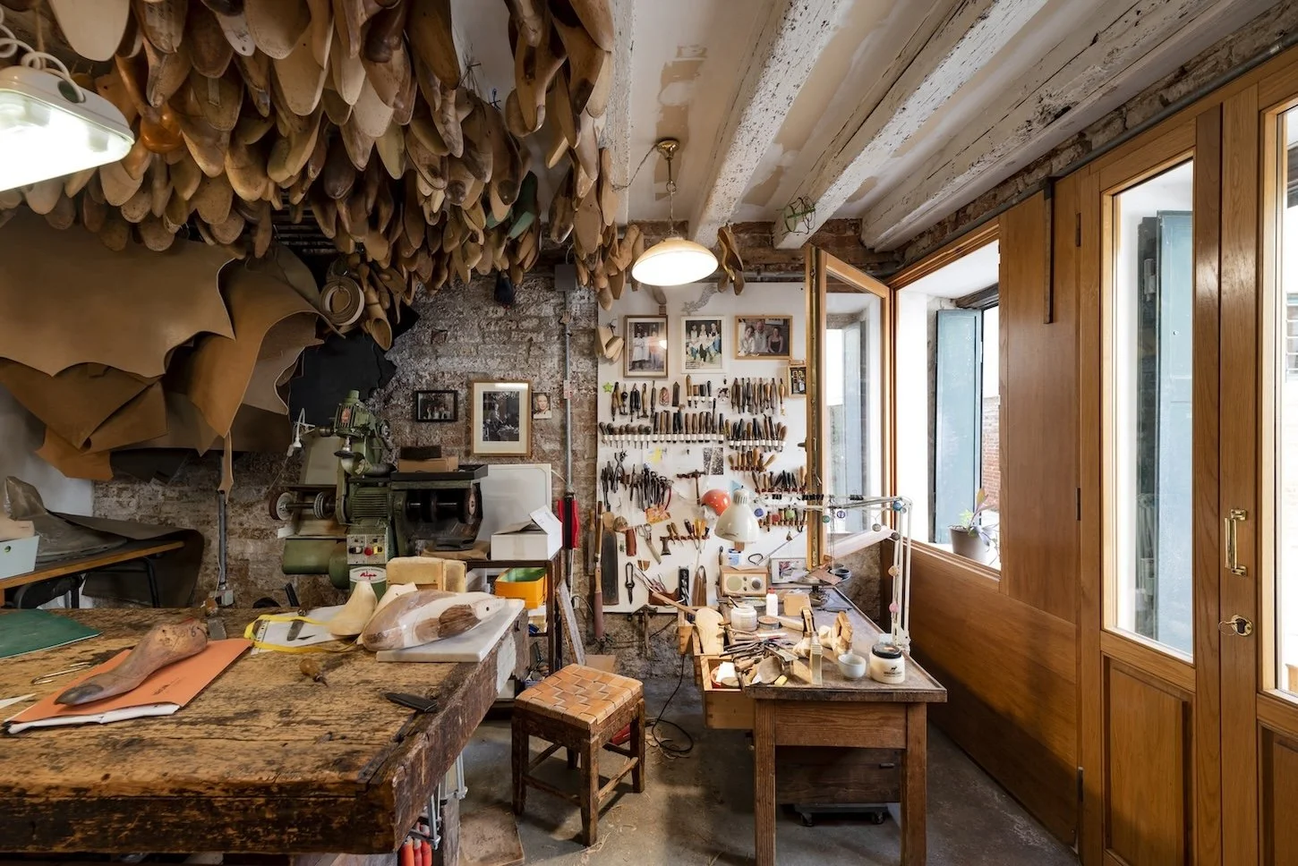Inside the artist studio of Gabriele Gmeiner, tools and models line the walls and ceiling
