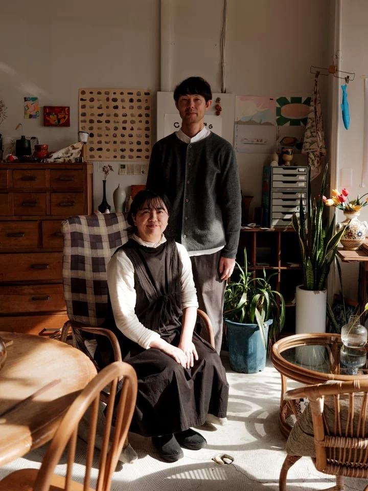 Shinya and Natsumi Sasakura, the owners of HOUSEHOLD in Toyama post for a portrait surrounded in Himi