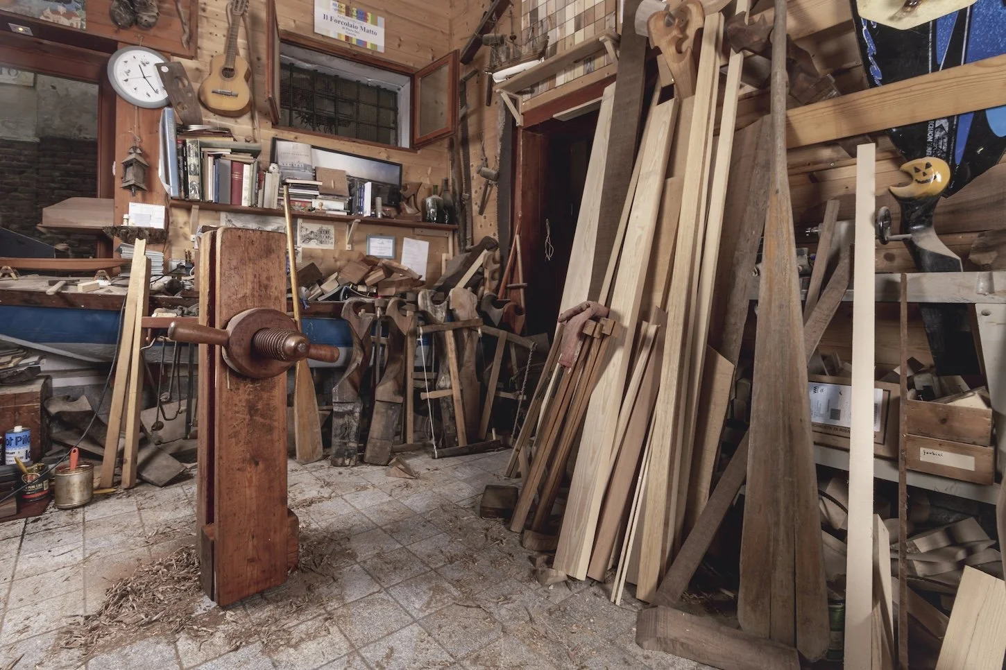 wood is piled up in an artist's studio in Venice