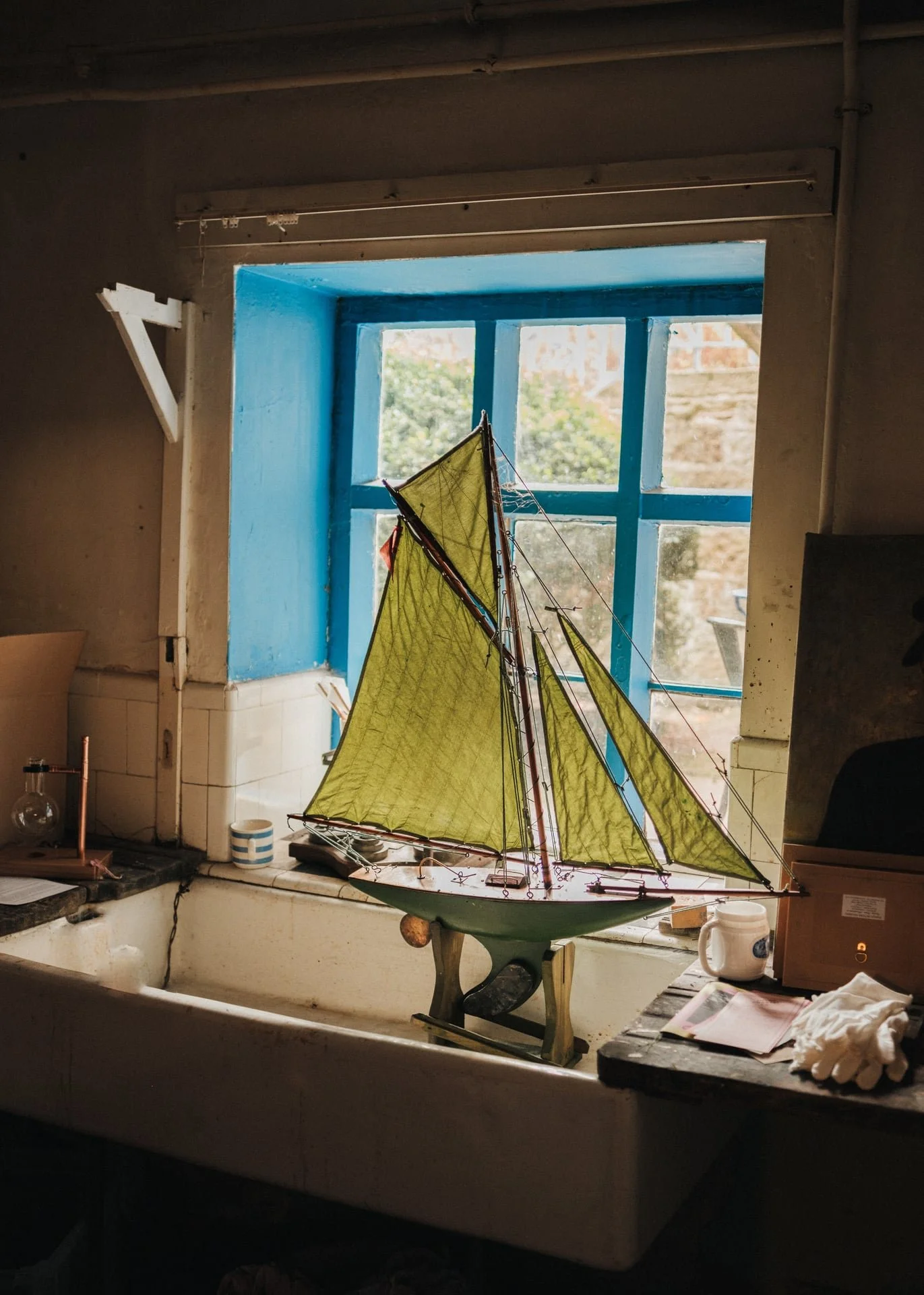 A vintage ship is bathed in sunlight by the window at Hawarden Estate, an estate in North Wales.
