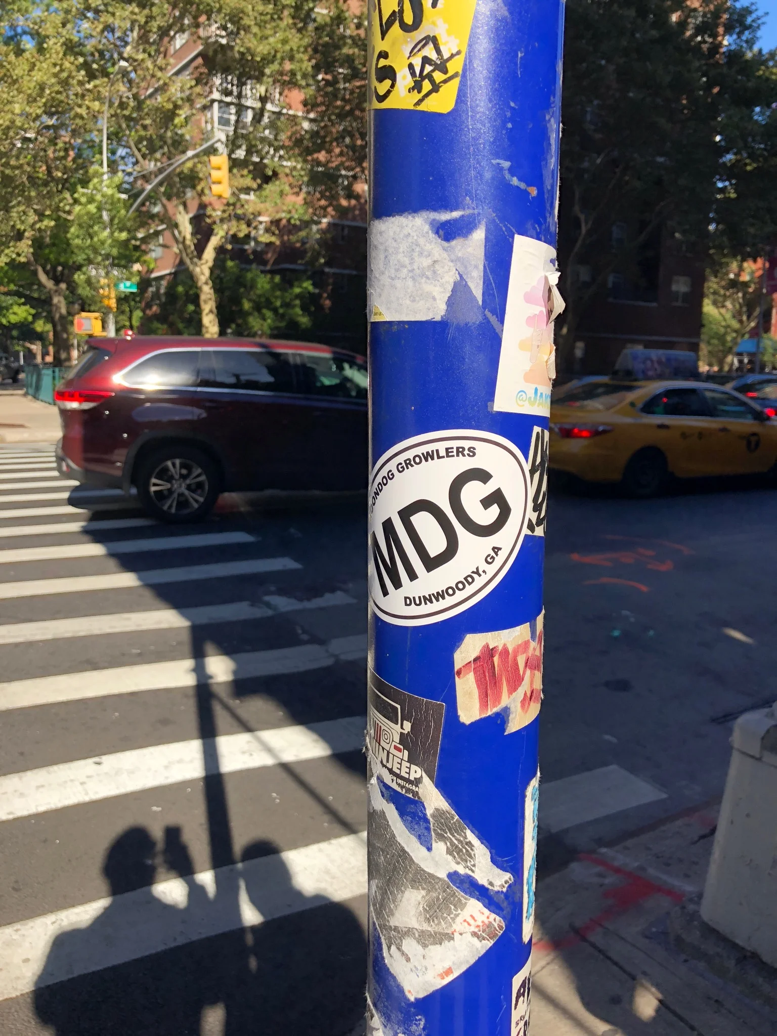 MDG sticker on a poll in Brooklyn, NYC