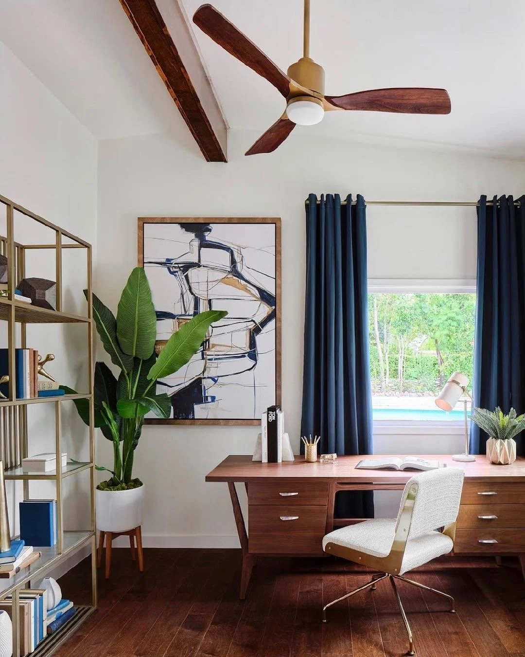 masculine office with blue curtains and wood accents