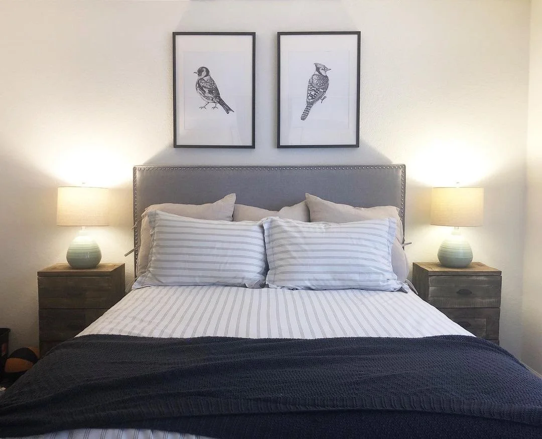 Vieve Interiors Masculine Interior Design - matching bird photos with dual nightstands and lamps