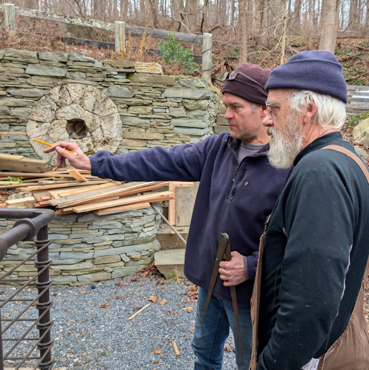 Derek Arnold and Robert Jones taking final measurements before construction begins in November. Photo by Bo Willse.