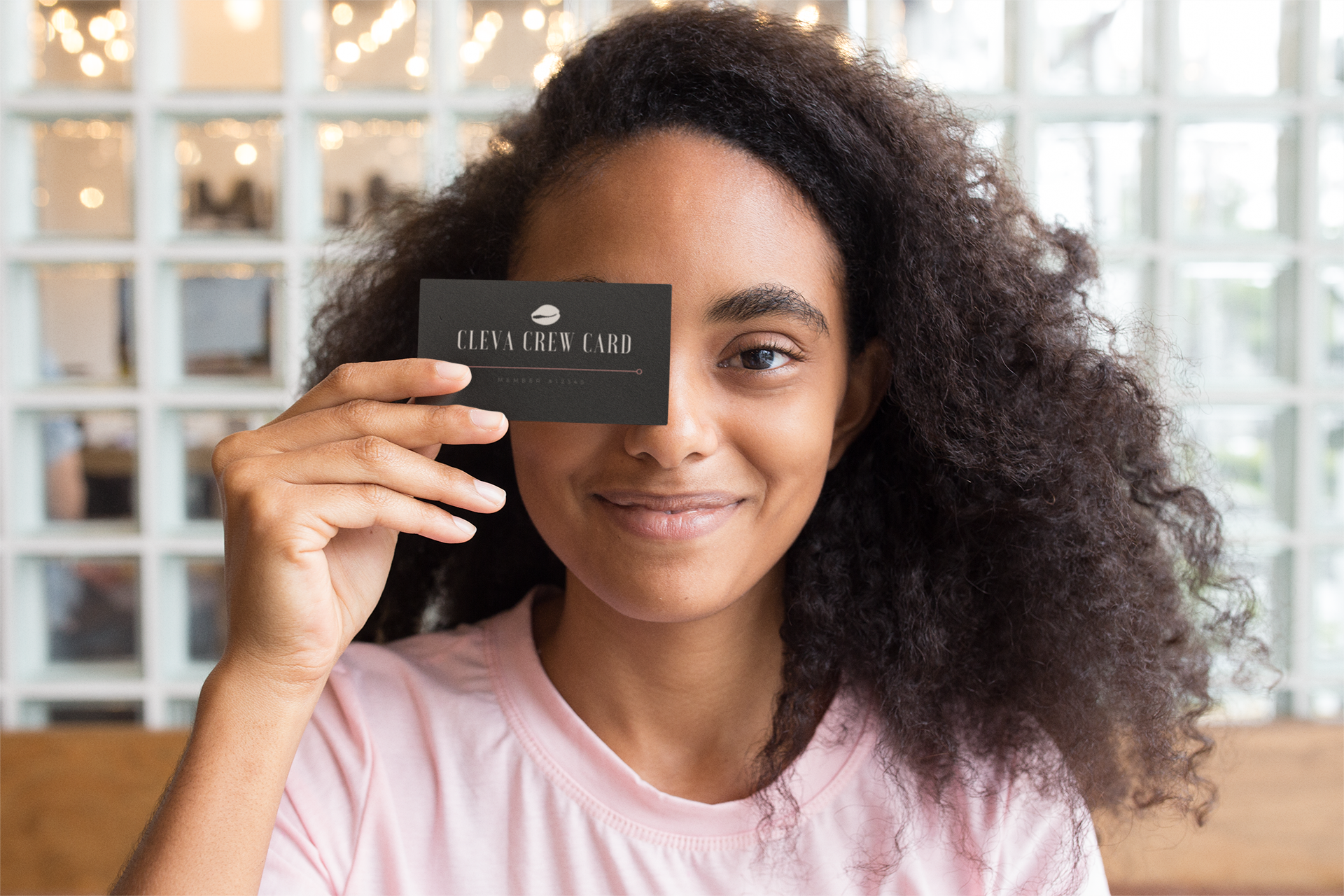 mockup-of-a-girl-holding-a-business-card-against-her-face-21922.png