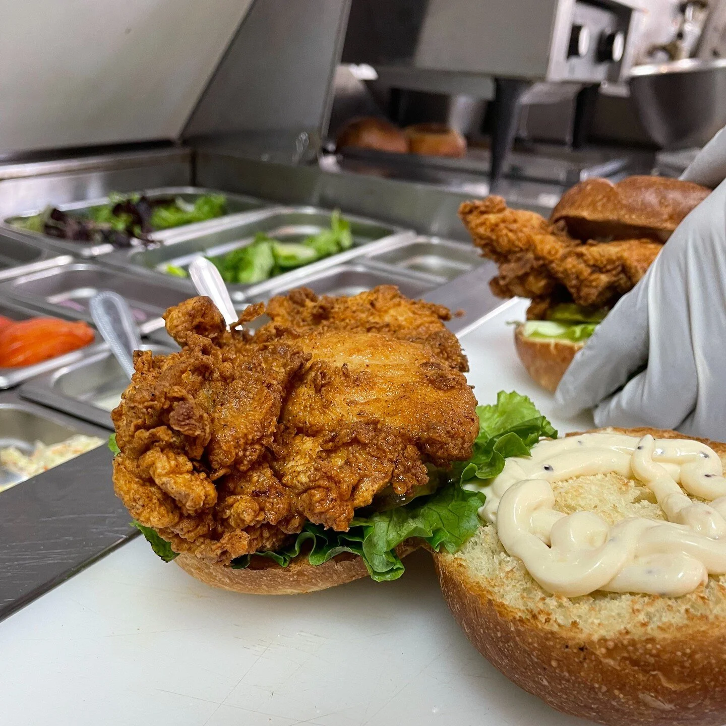 Action shot: Two Buttermilk Sandwiches about to be packed up and sent on their way! Beautiful house-made chicken thighs fried to complete perfection is one of our specialties!
#buttermilk #chickenthigh #friedchicken #sandwichesofinstagram #eatpassyun