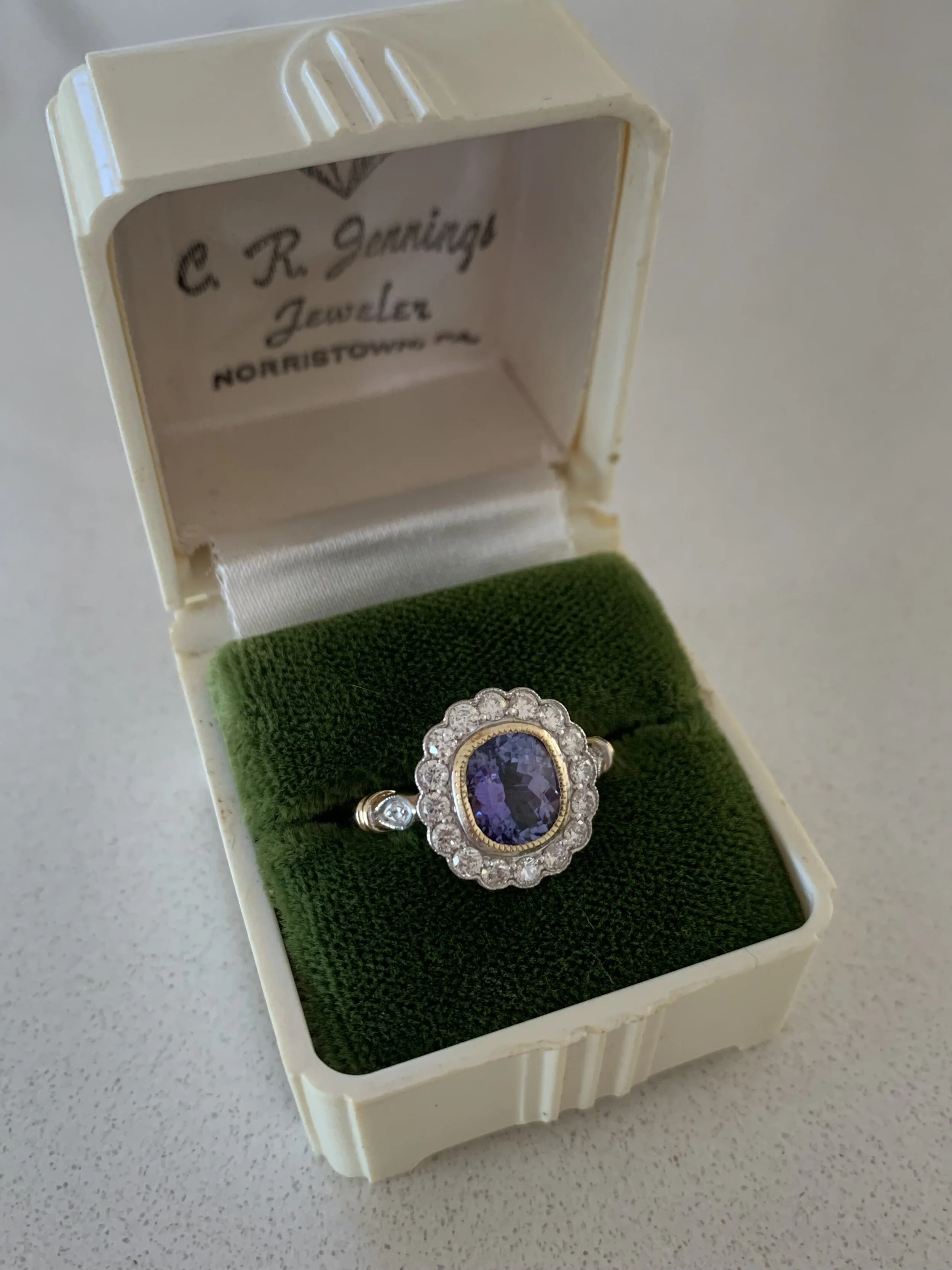 FINE QUALITY TANZANITE AND DIAMOND RING WITH VALUATION AS PICTURED