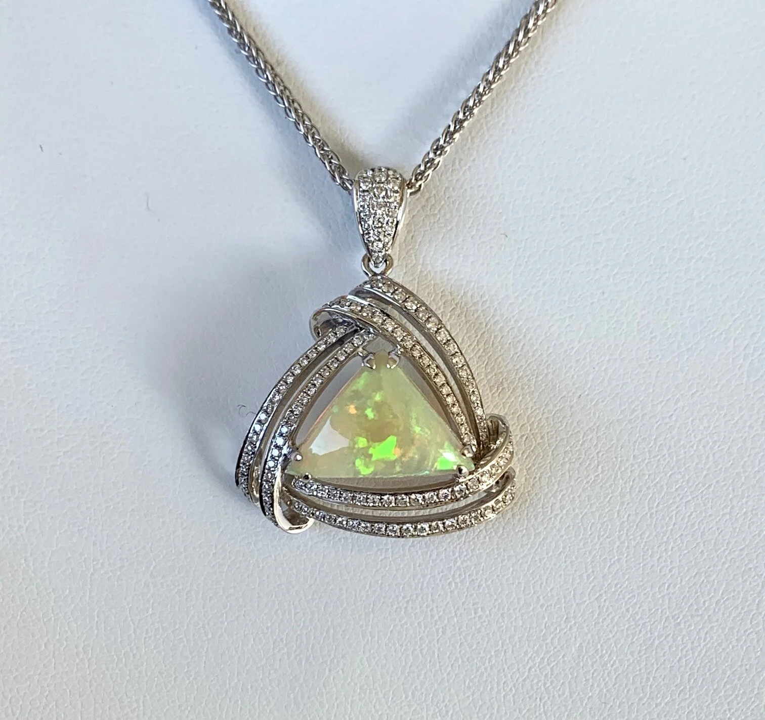 A MAGNIFICENT SOLID OPAL AND DIAMOND PENDANT WITH CHAIN AND VALUATION
